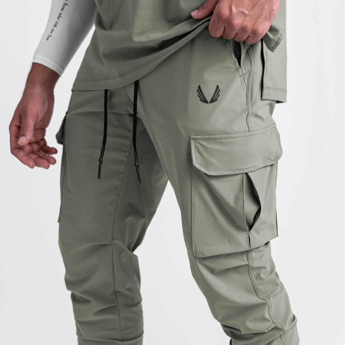 Tetra-Lite Cargo High Rib Jogger in sage, worn by model showing side and front view