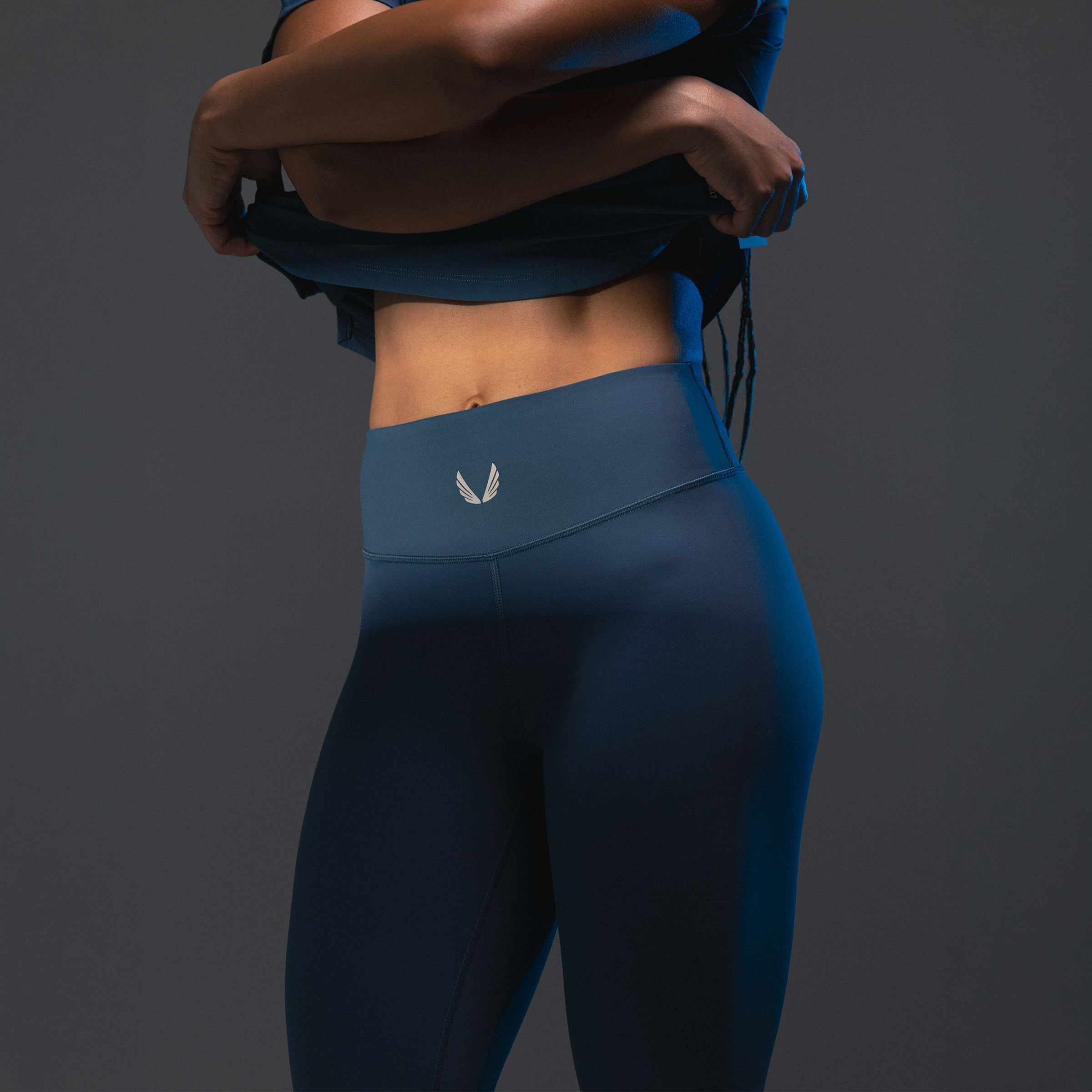 W002 LYCRA® ADAPTIV Legging in Storm blue, worn by model from waist down