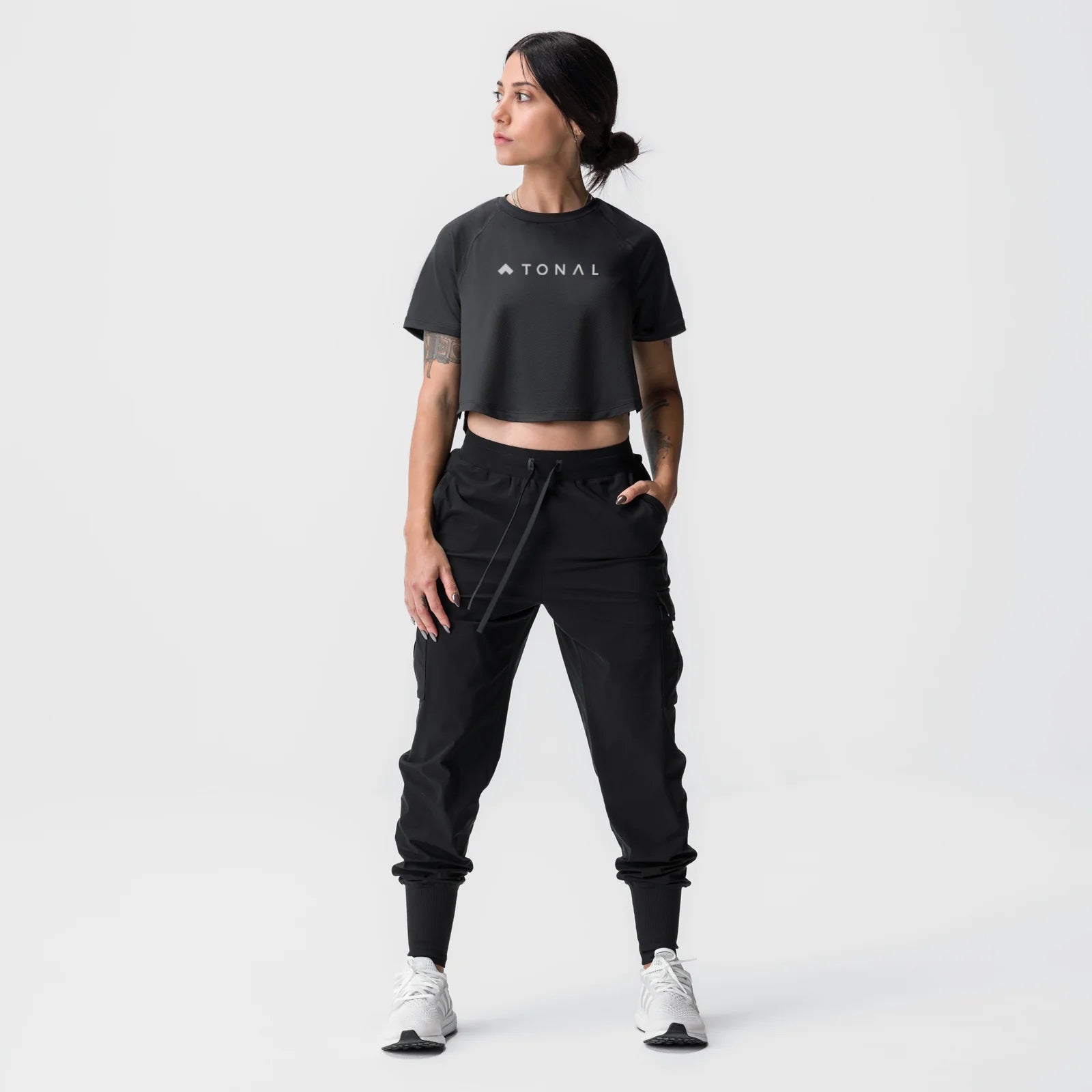 ASRV Tonal cropped training tee in black, worn with cargo joggers, front view