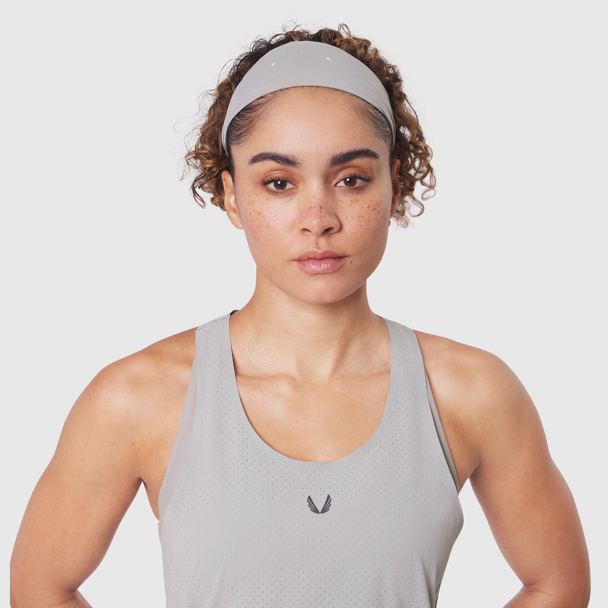 Ice-Skin™ Performance Headband in slate grey, worn by model in front view