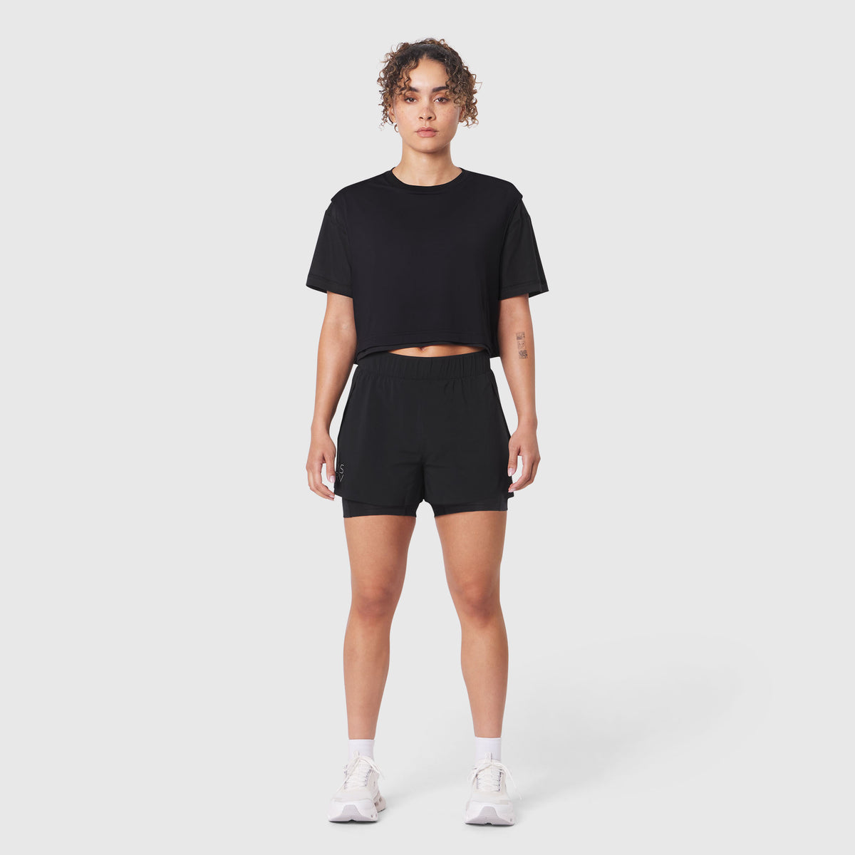W082 Supima Ice-Skin Reversible Crop Tee in black, worn with matching shorts, front view