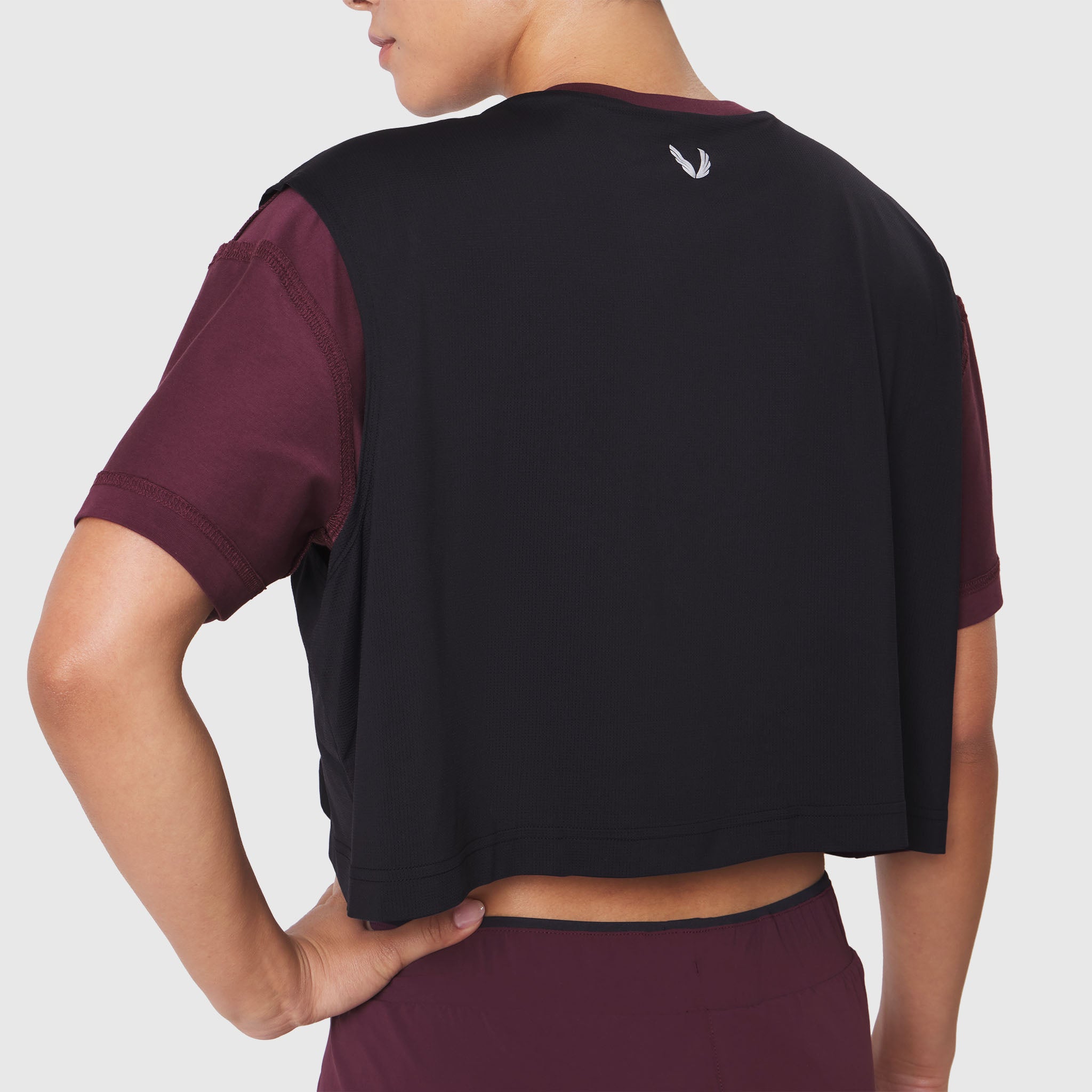 Reversible Crop Tee in Merlot/Black, back view on model