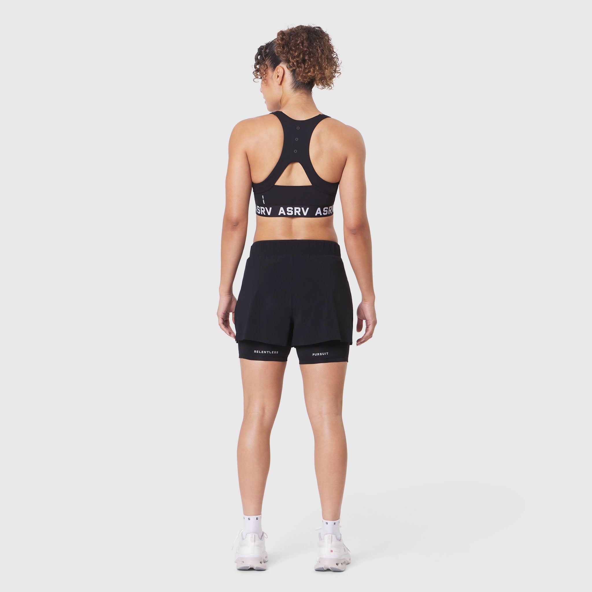 W083 LYCRA® ADAPTIV Racerback Sports Bra in black, back view on model