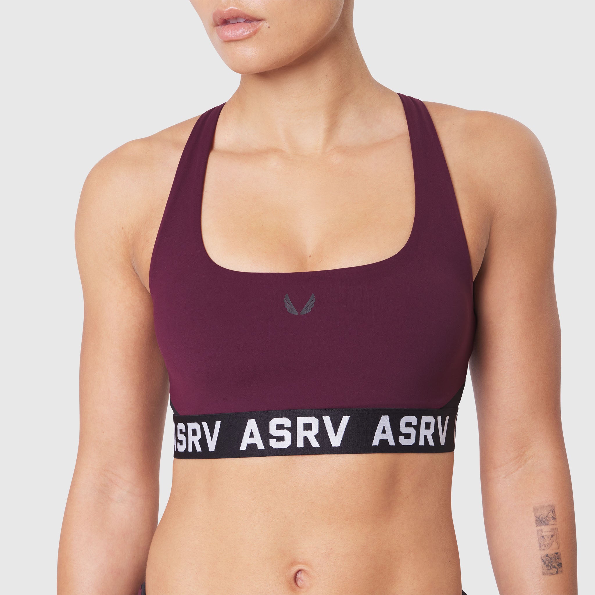 W083 LYCRA® ADAPTIV Racerback Sports Bra in Merlot, front view on model