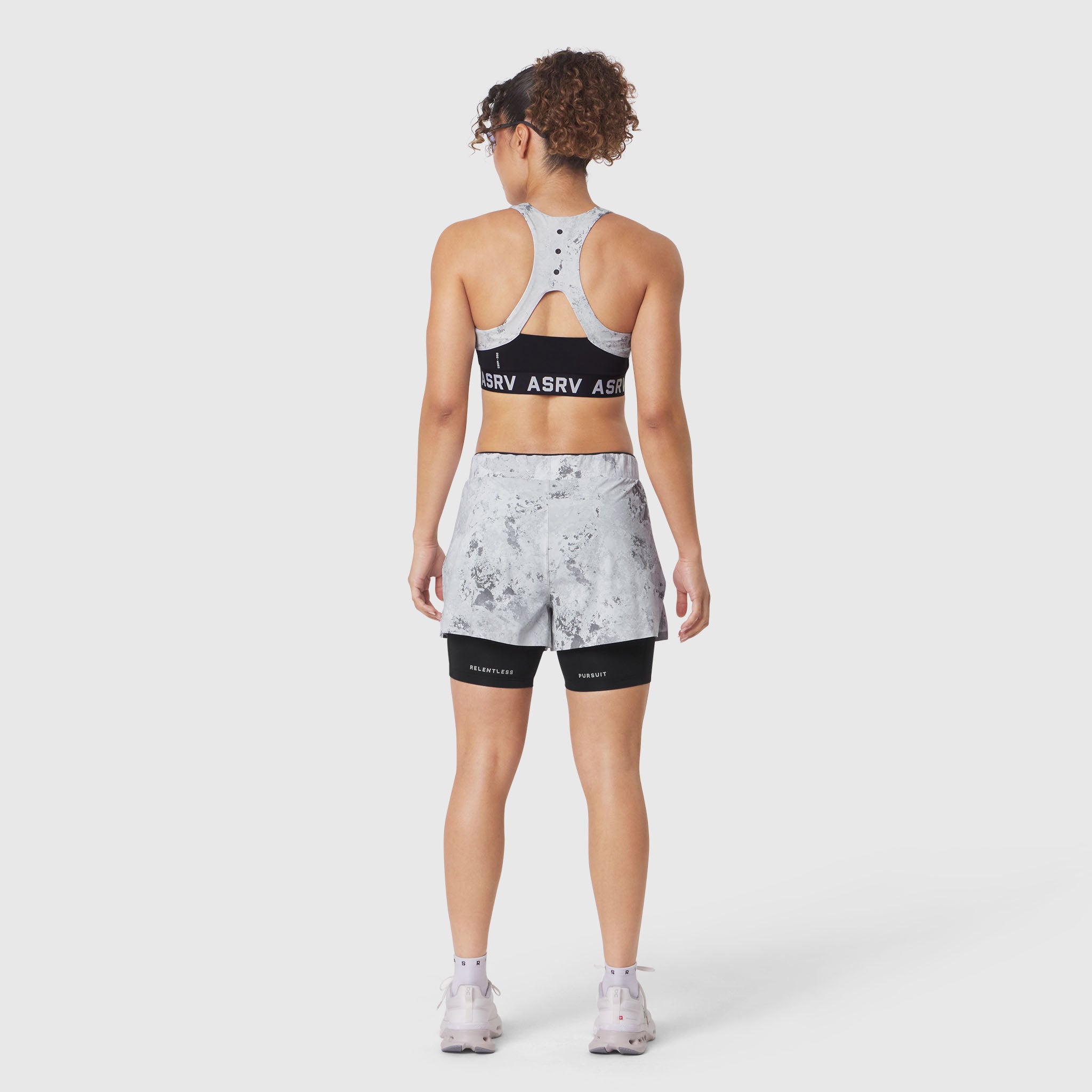 W083 LYCRA® ADAPTIV Racerback Sports Bra in Sedona Snow Camo, back view on model