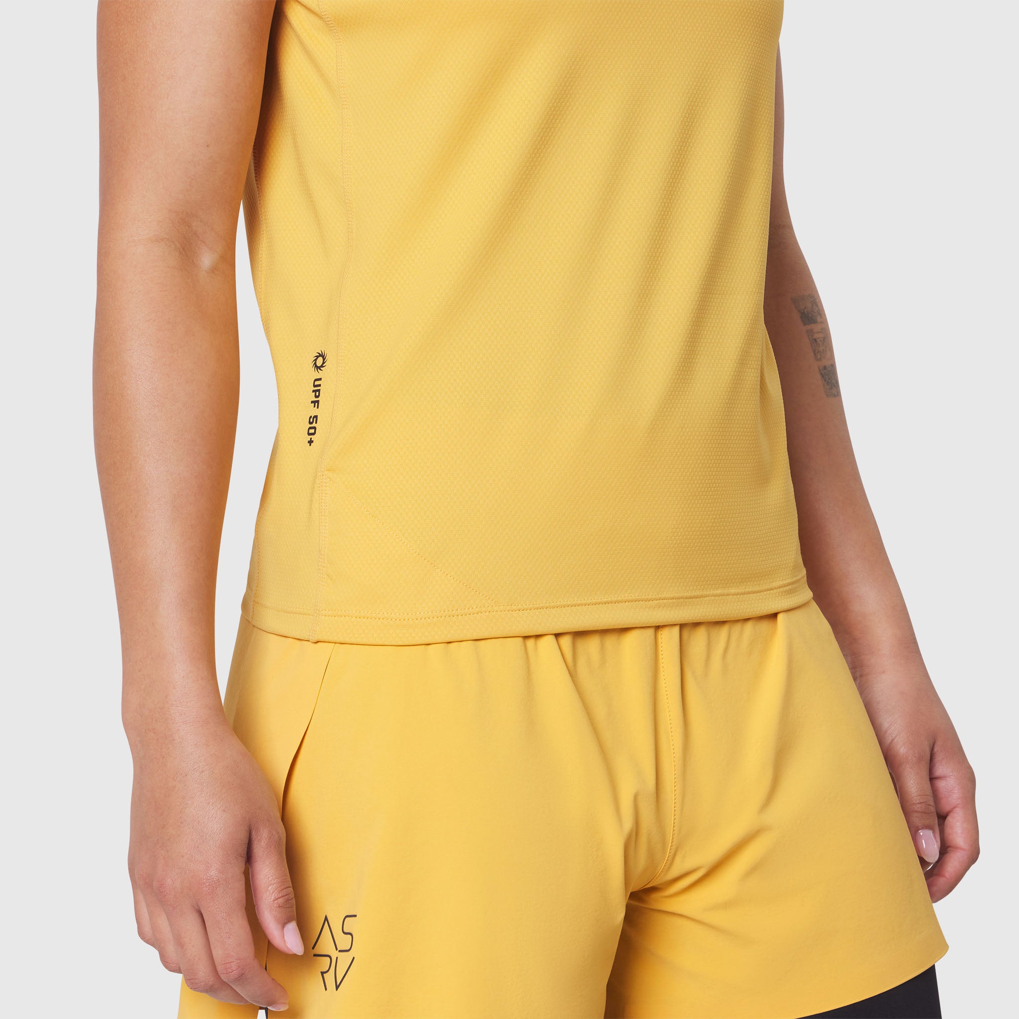 AEROSILVER® UPF50+ Run Tee in Amber, worn by model, side view