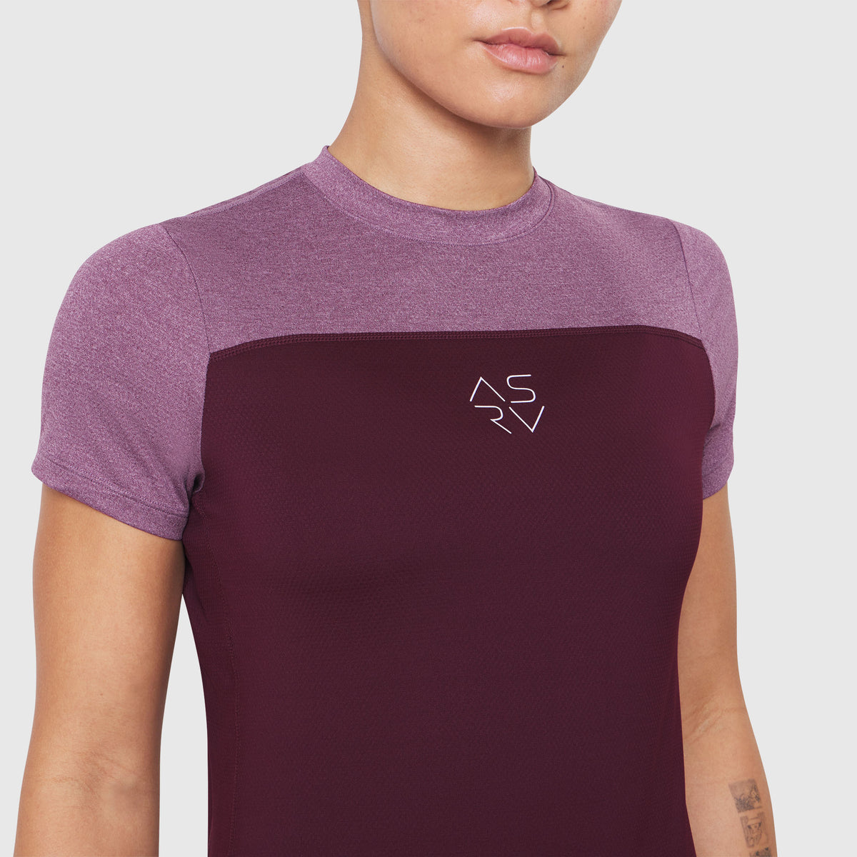 AEROSILVER® UPF50+ Run Tee in Merlot and mauve, worn by model, front view