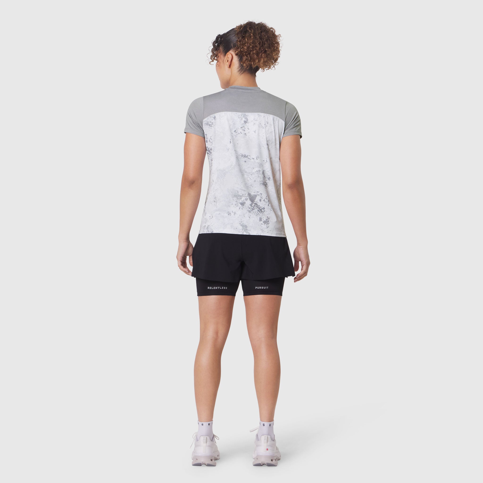 W086 AEROSILVER® UPF50+ Run Tee in Sedona Snow Camo, back view on model