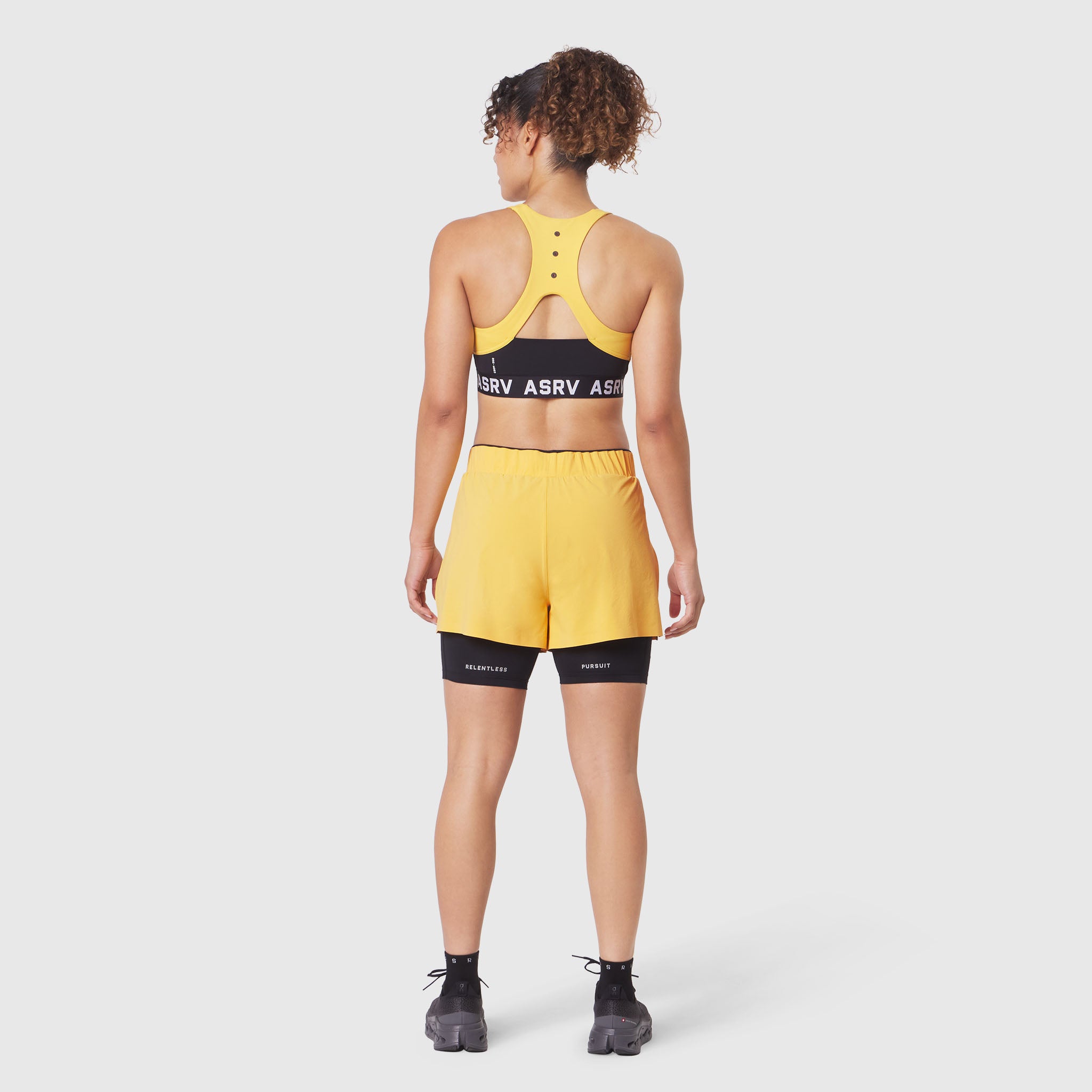 W087 Aerotex™ Side Split Liner Short in Amber, back view on model