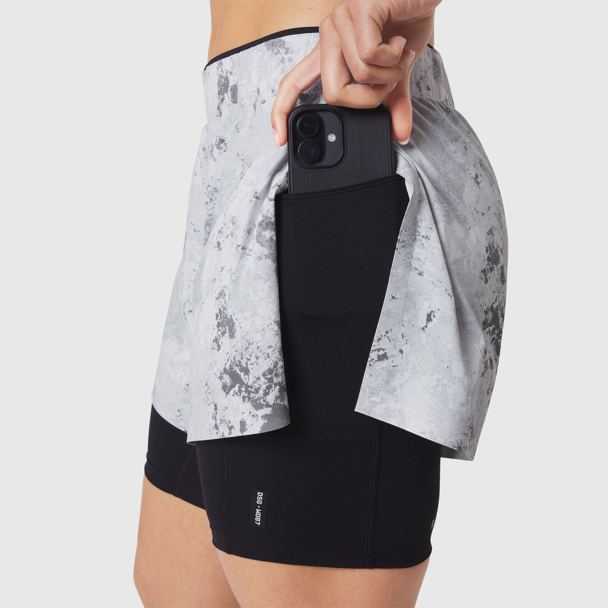 W087 Aerotex Side Split Liner Short in Sedona Snow Camo, worn with phone in pocket