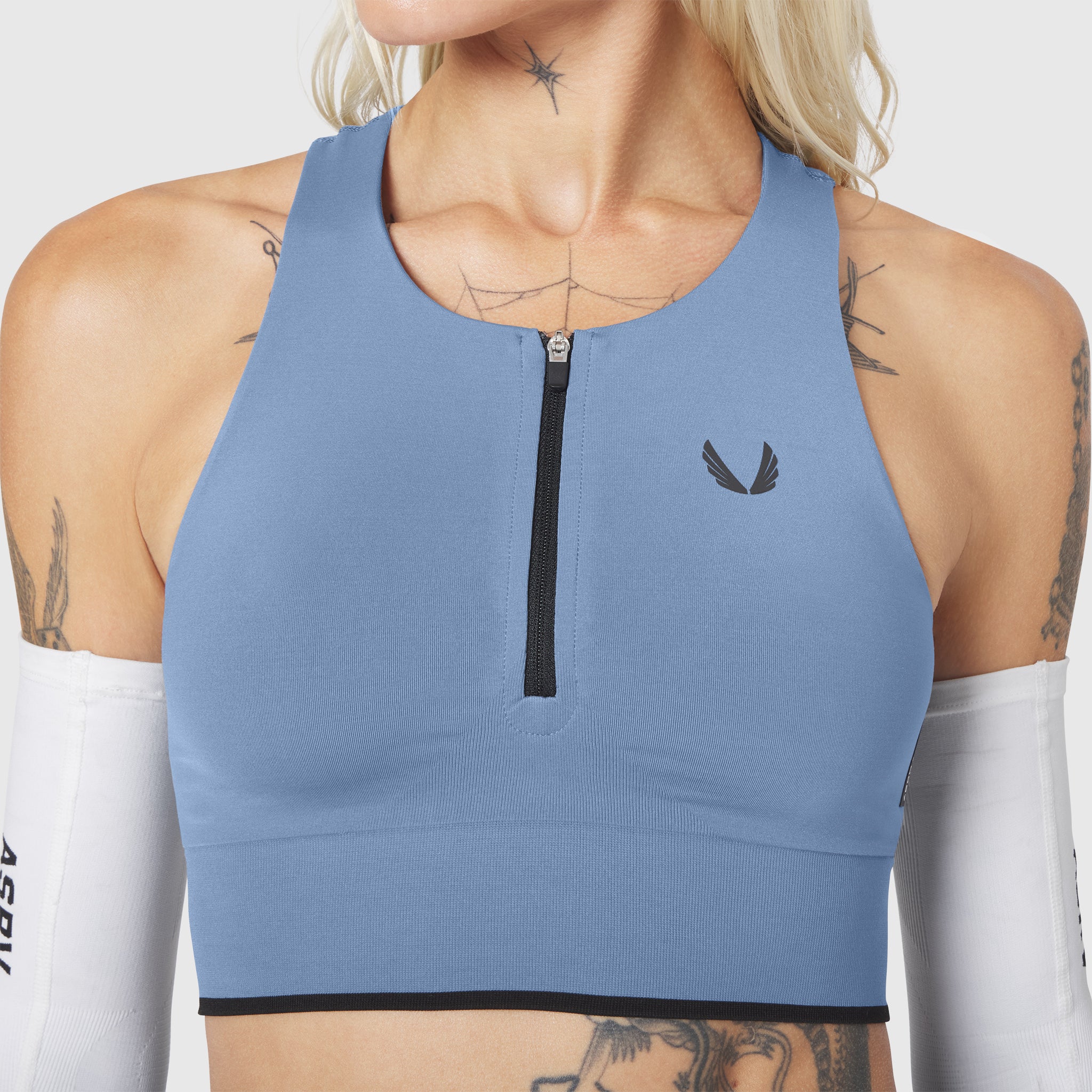 W097 LYCRA® ADAPTIV Seamless Zip Bra in Slate Blue, front view on model