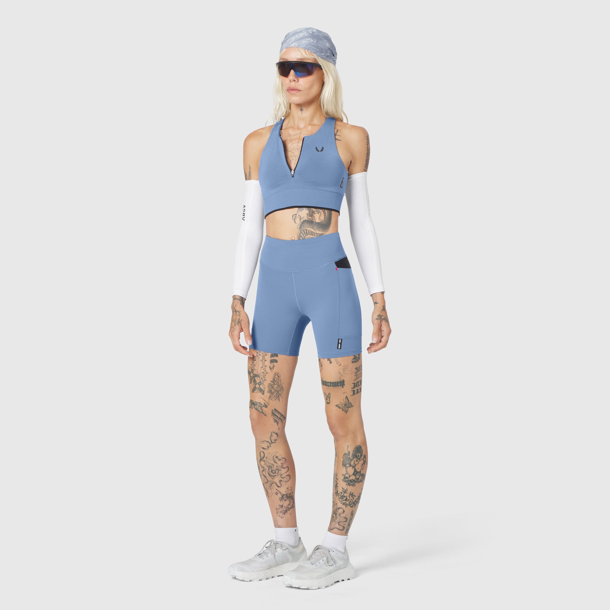 W097 LYCRA® ADAPTIV Seamless Zip Bra in Slate Blue, front view on model