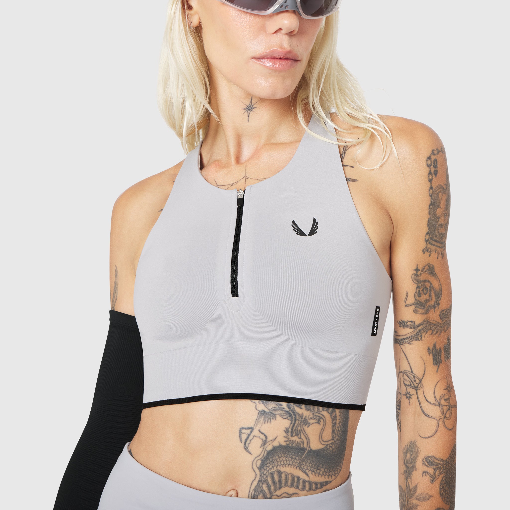 W097 LYCRA® ADAPTIV Seamless Zip Bra in Slate Grey, front view on model