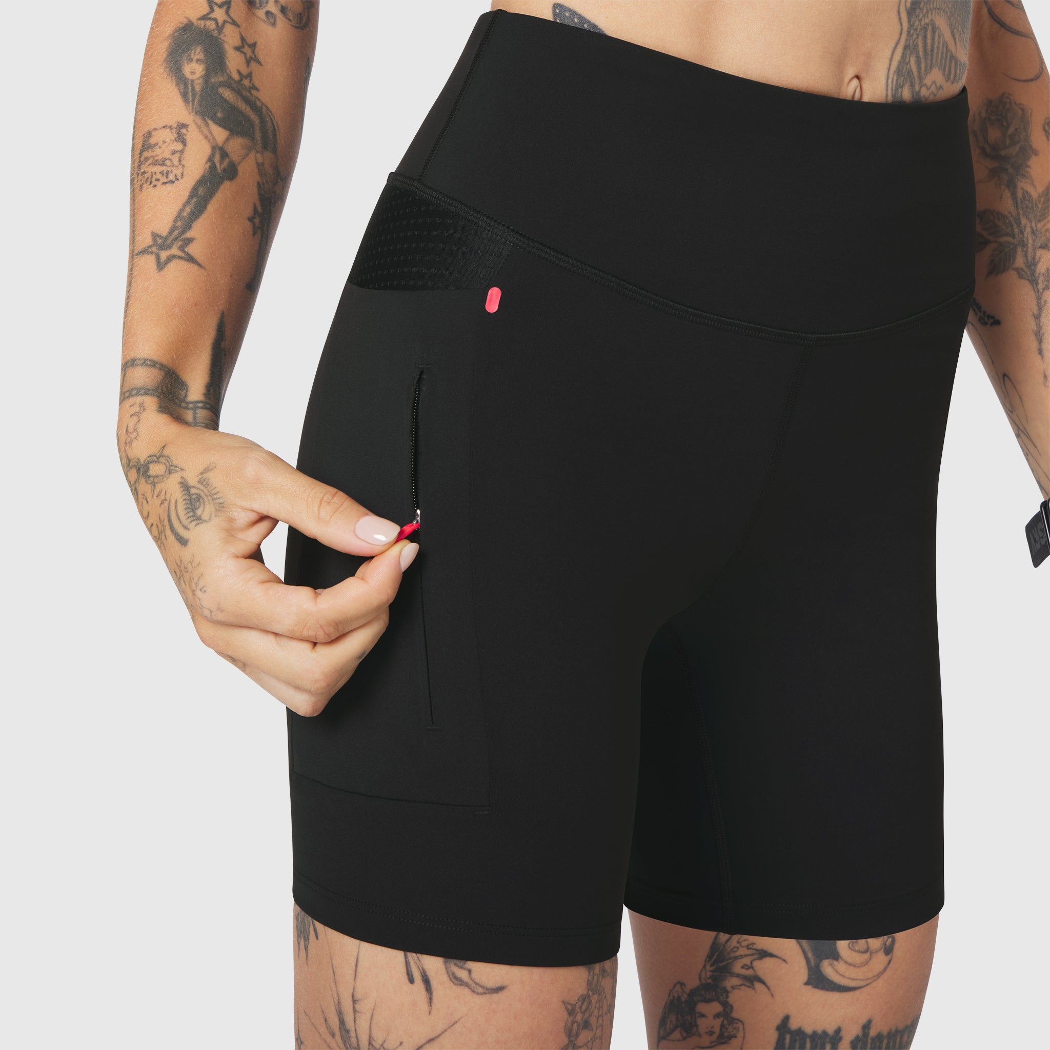 W099 LYCRA® ADAPTIV Hybrid Bike Short in black, worn by model showing side pocket detail