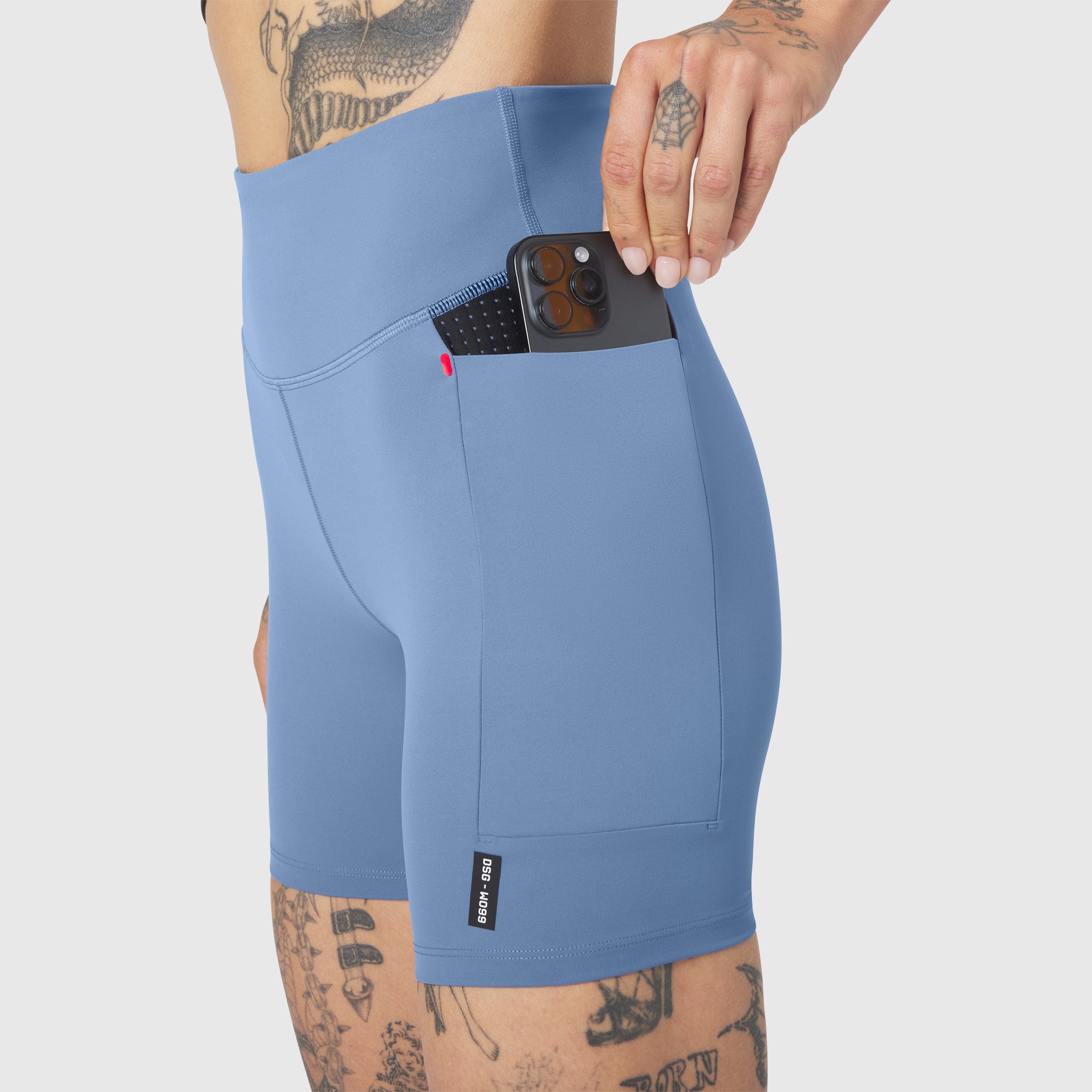 W099 LYCRA® ADAPTIV Hybrid Bike Short in Slate Blue, worn with phone in pocket