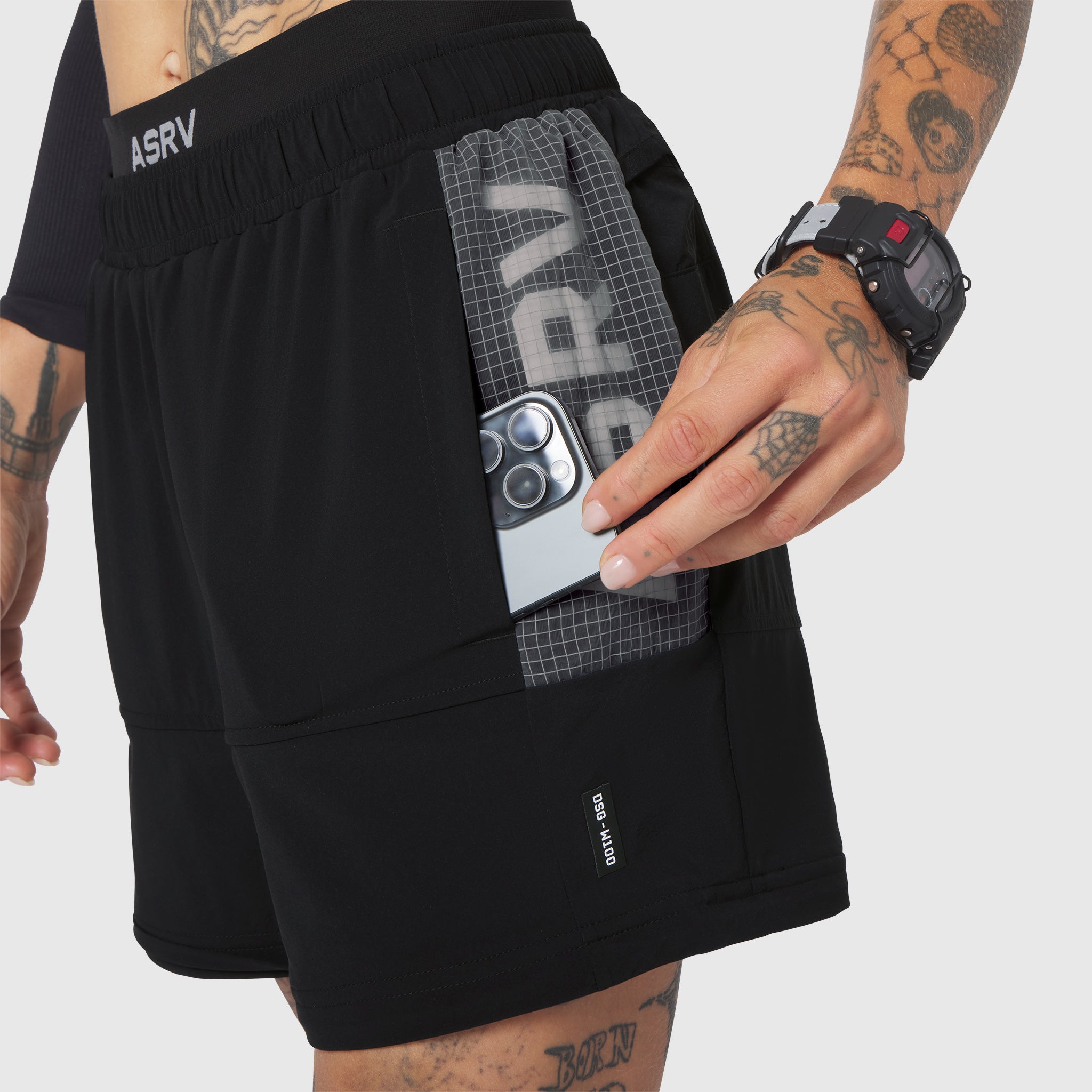 W100 2-in-1 convertible pant in black, worn with phone in pocket