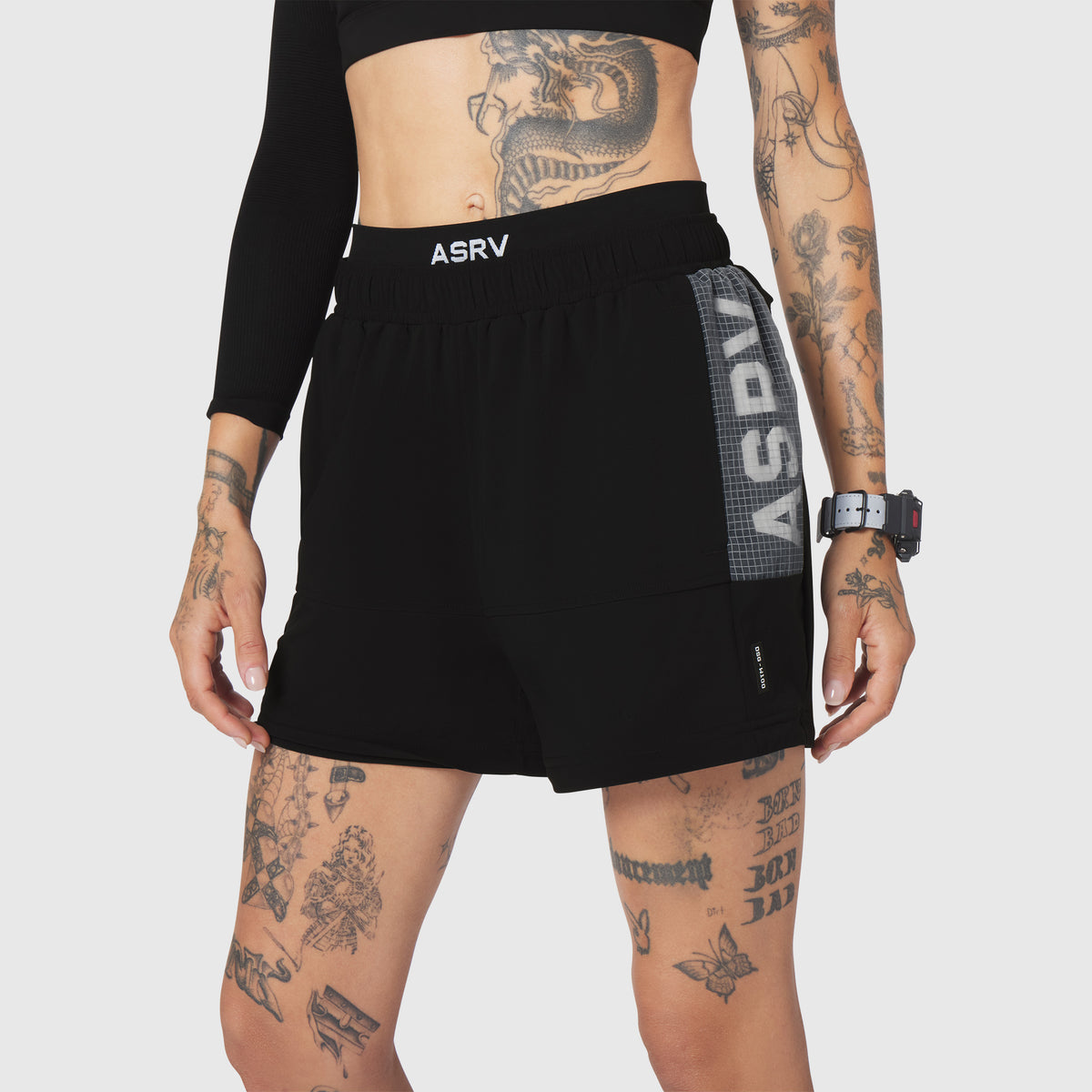 W100 2-in-1 convertible shorts in black, front view on model