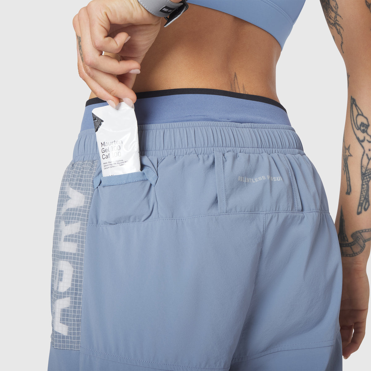 W100 2-in-1 Convertible Pant in Slate Blue, worn by model showing back pocket detail