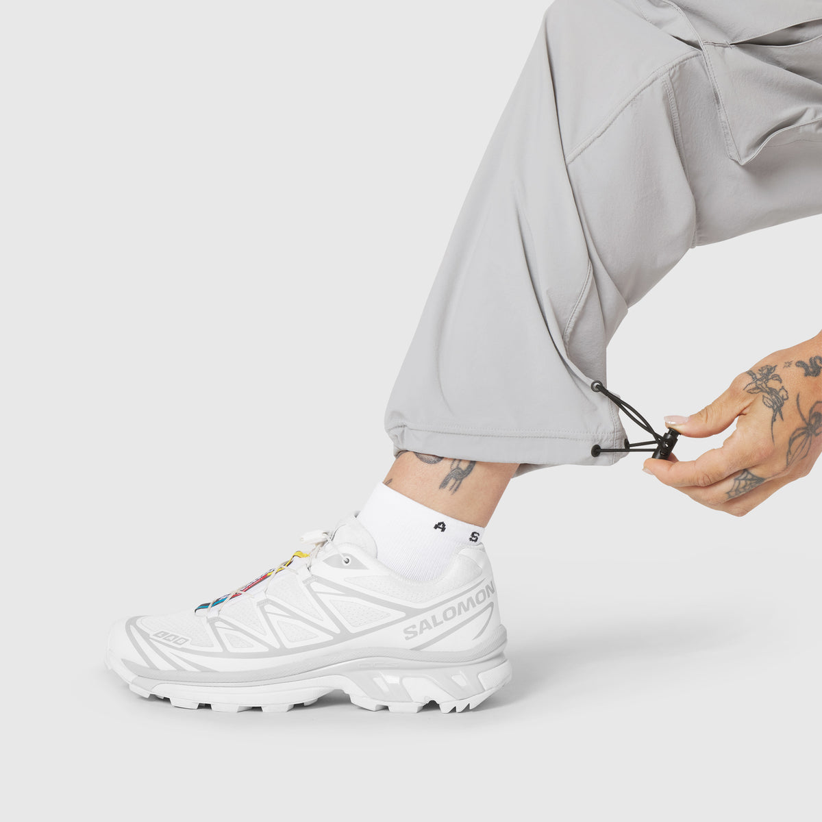 W100 2-in-1 Convertible Pant in Slate Grey, worn with white sneaker, side view