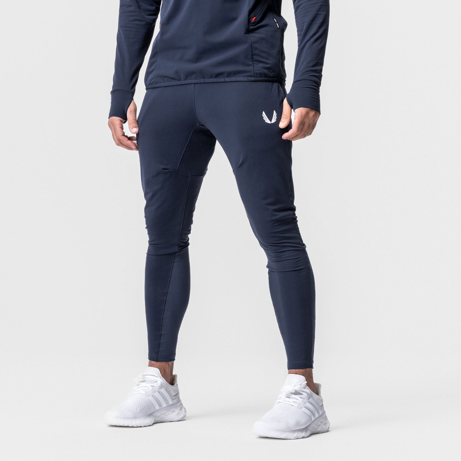 Thermal Hybrid Jogger in navy worn by model, back view showing fit and white logo detail