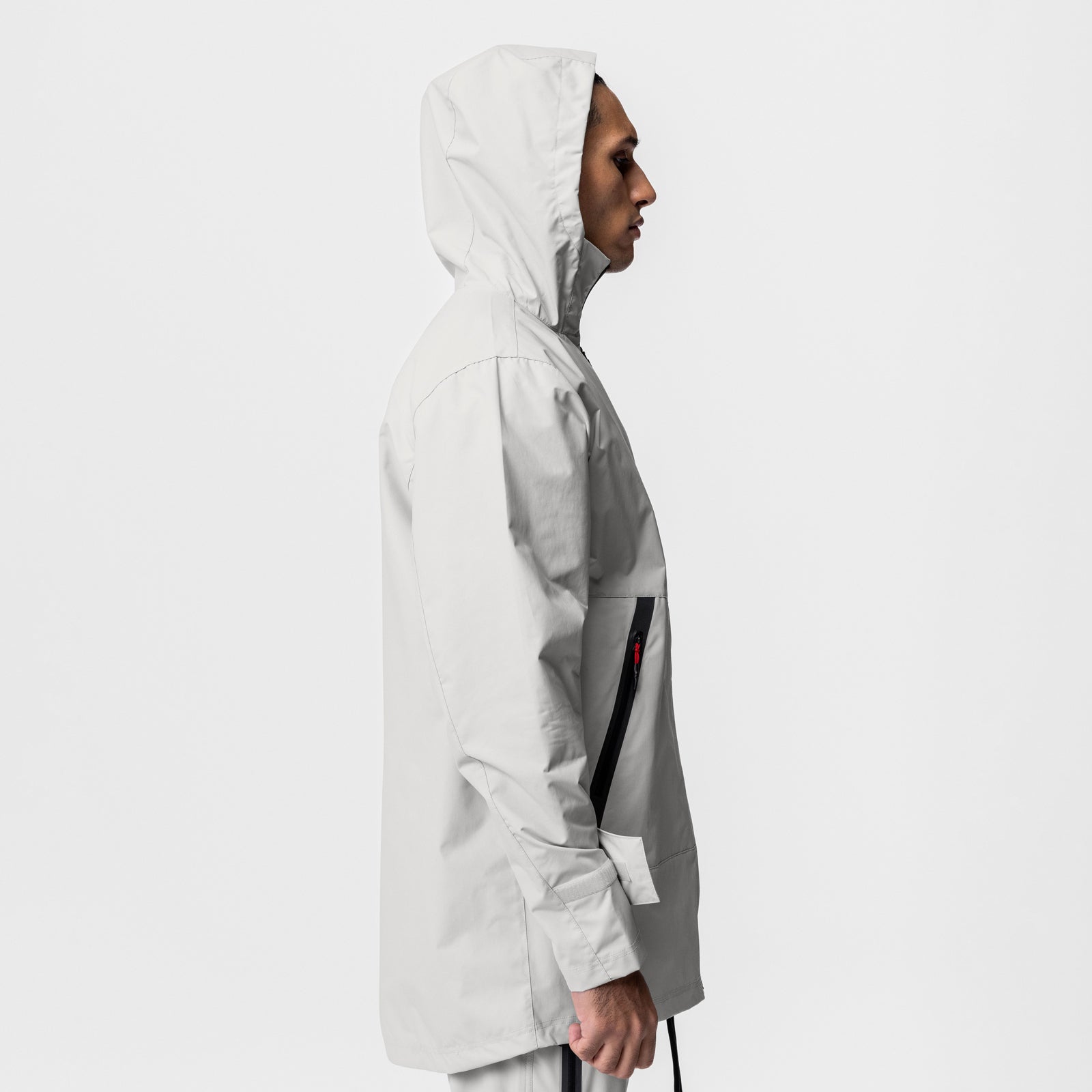Hipora® Tech Parka in stone, modeled in profile view with hood up