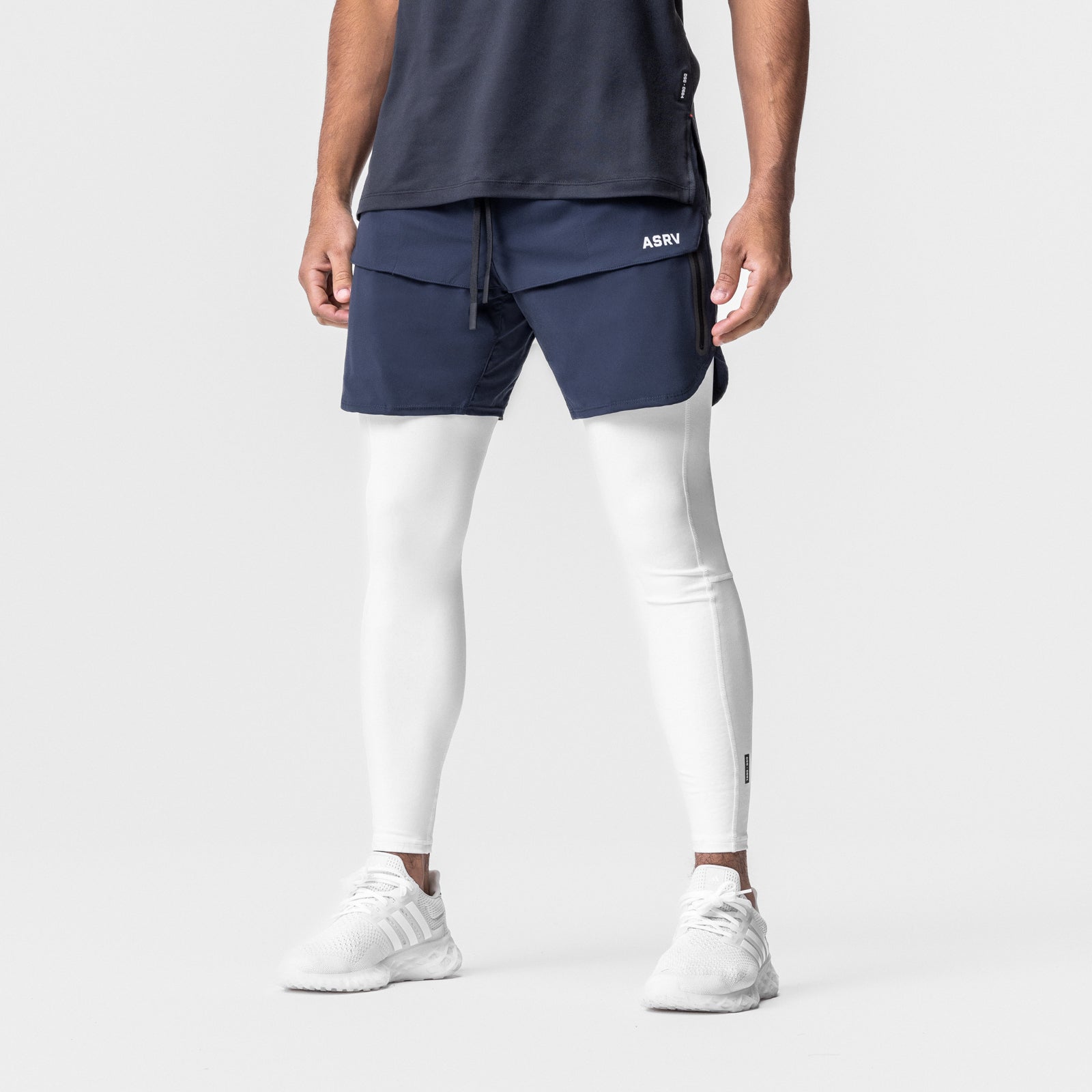 Tetra-Lite 7" Tech Short in navy with white leggings, modeled front view