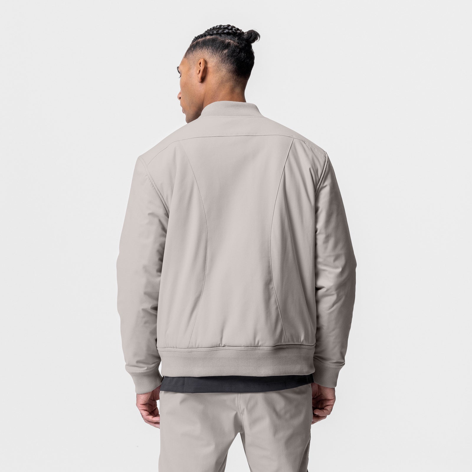 Kinterra Weatherproof Bomber Jacket in chai, worn by model, back view