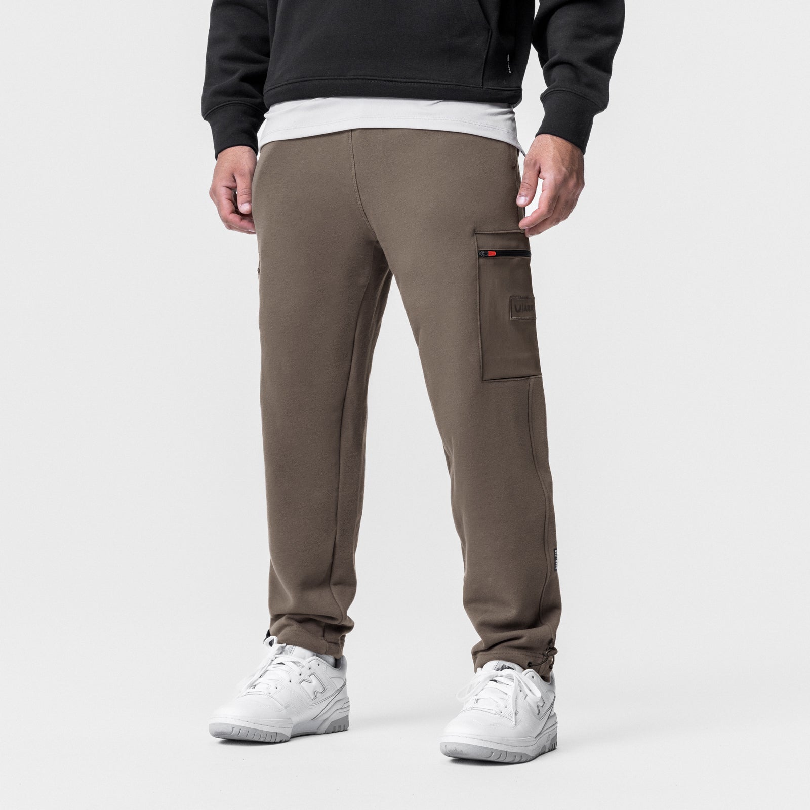 Tech-Terry Cinch Cargo Jogger in deep taupe, worn by model from behind with white sneakers