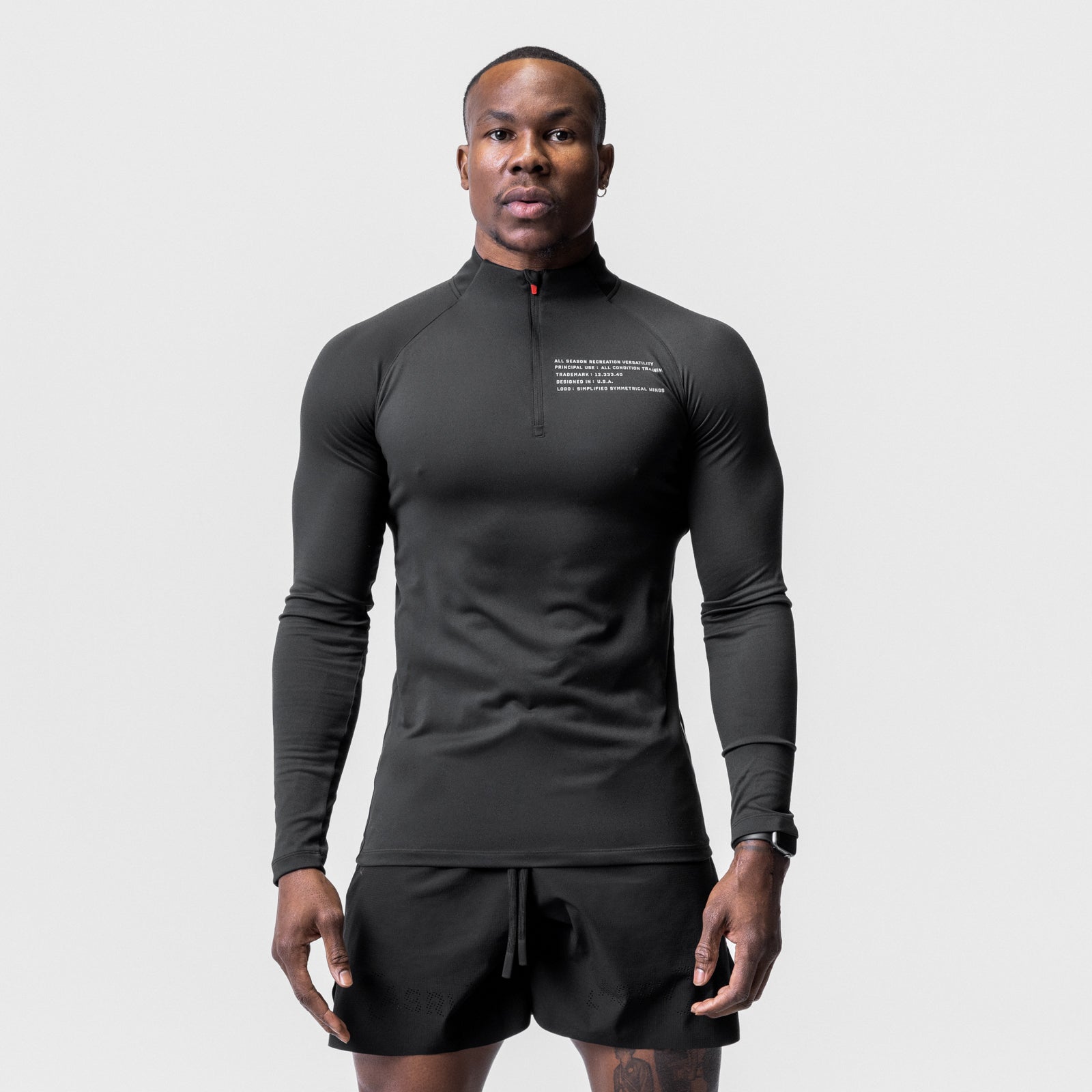 Core Fitted Quarter Zip in black worn by male model, front view