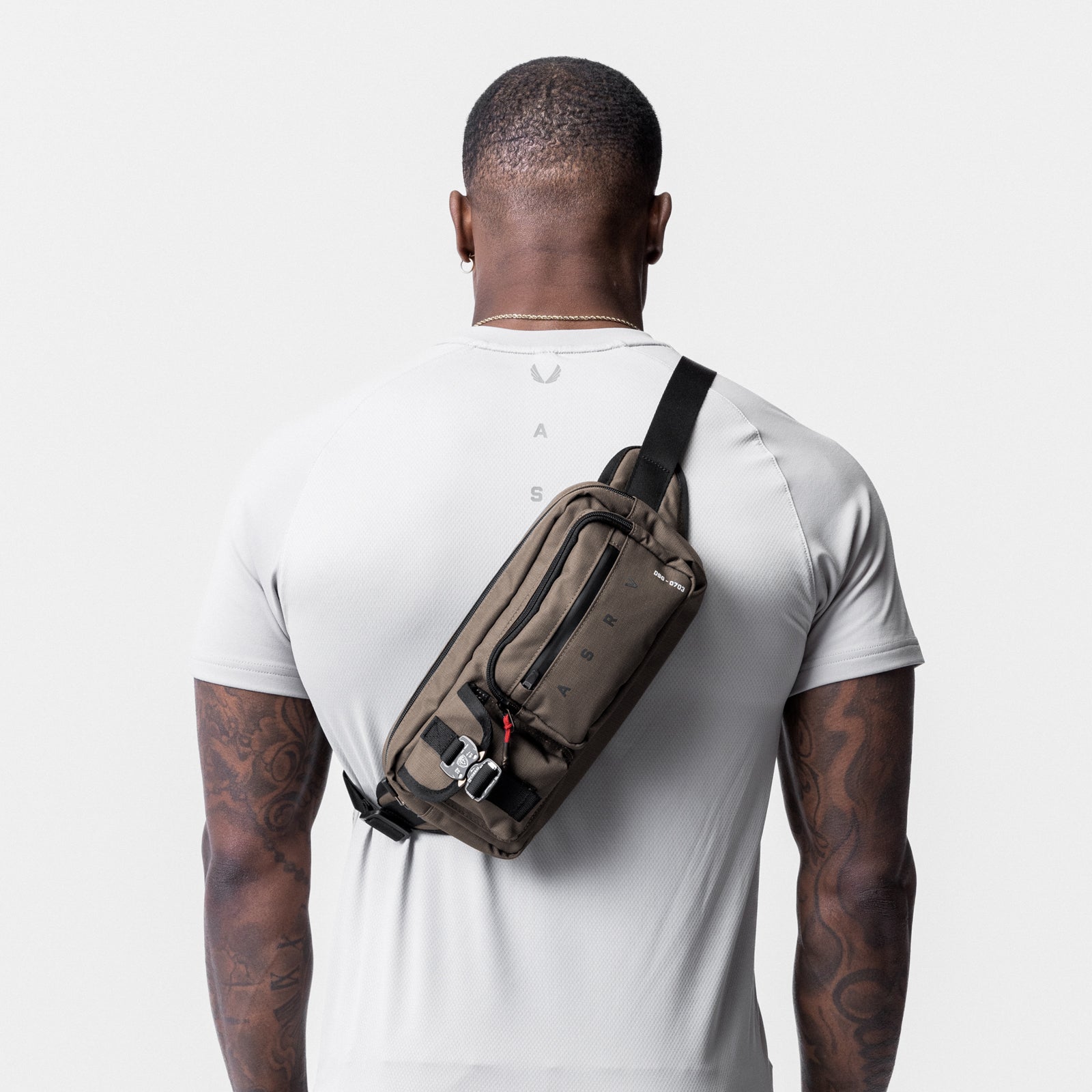 0703 Cordura® Tech Crossbody Pack in Deep Taupe, worn on shoulder, back view