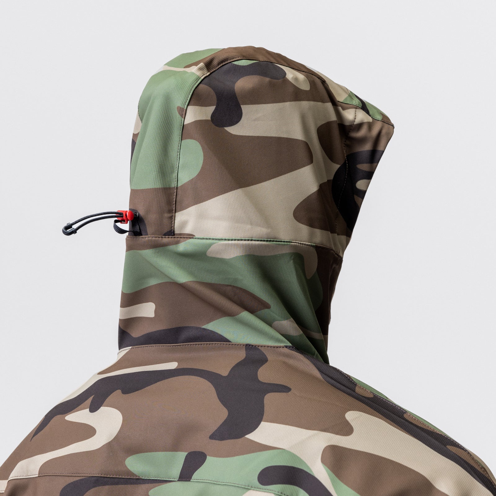 Weather-Ready Anorak Jacket in Woodland Camo worn by model, hood up, back view