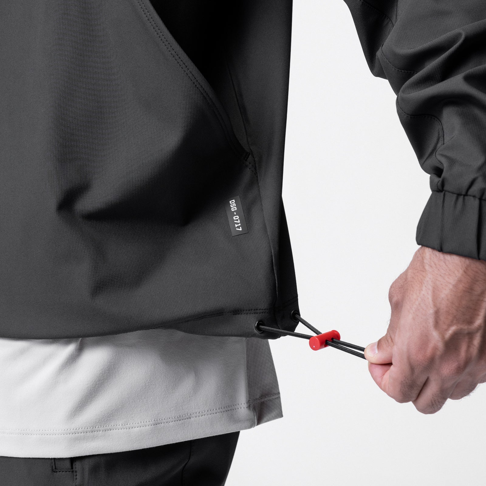 Weather-Ready Anorak Jacket in black, model holding drawstring detail