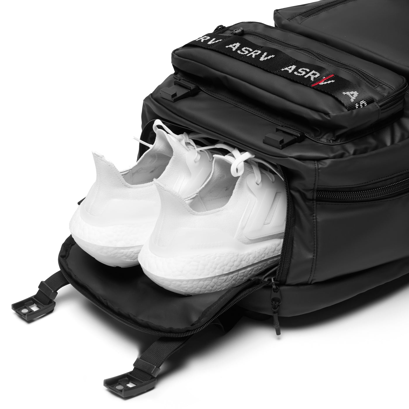 Flatlay ASRV 0580 waterproof large travel backpack in black with white sneakers