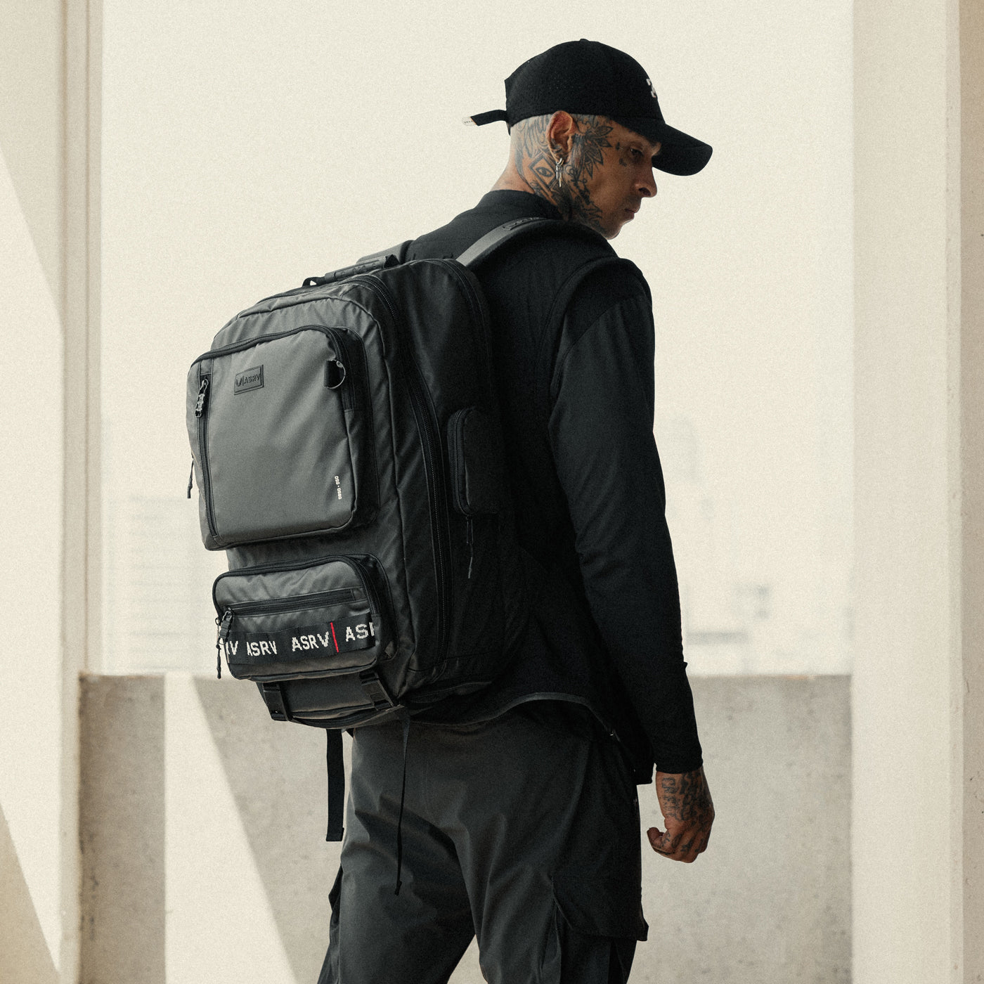 0580 Waterproof Large Travel Backpack in black, worn by model from back view