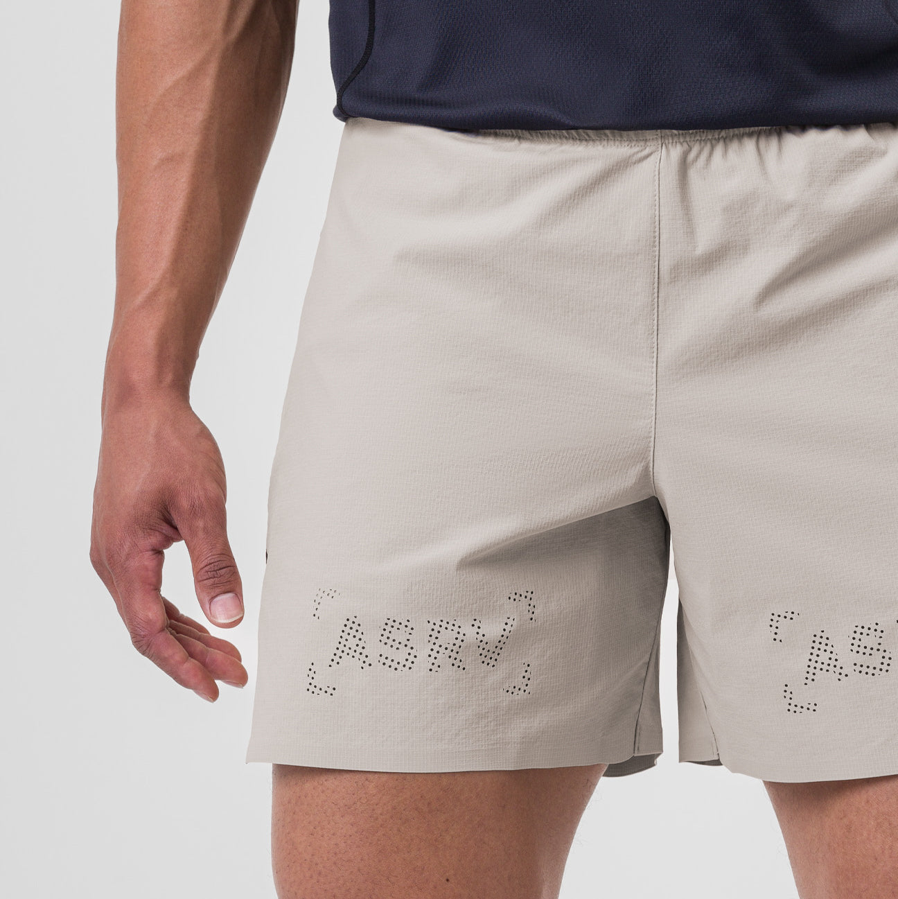 Ripstop 6" Perforated Short in Chai worn by model, side view detail