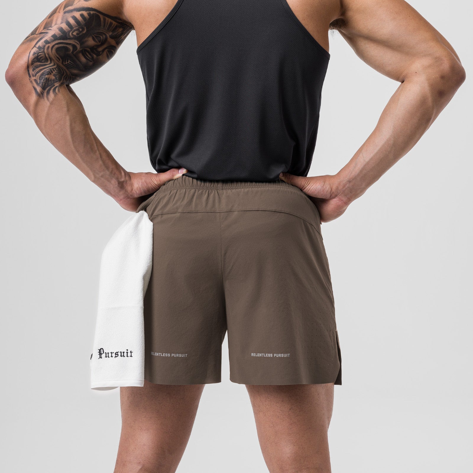 Ripstop 6" Perforated Short in Deep Taupe, back view on model with hands on hips