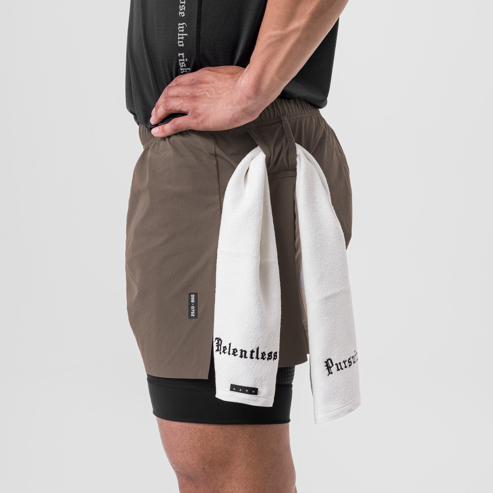 Ripstop 3" High Split Liner Short in Deep Taupe/Black worn by model, side view with towel