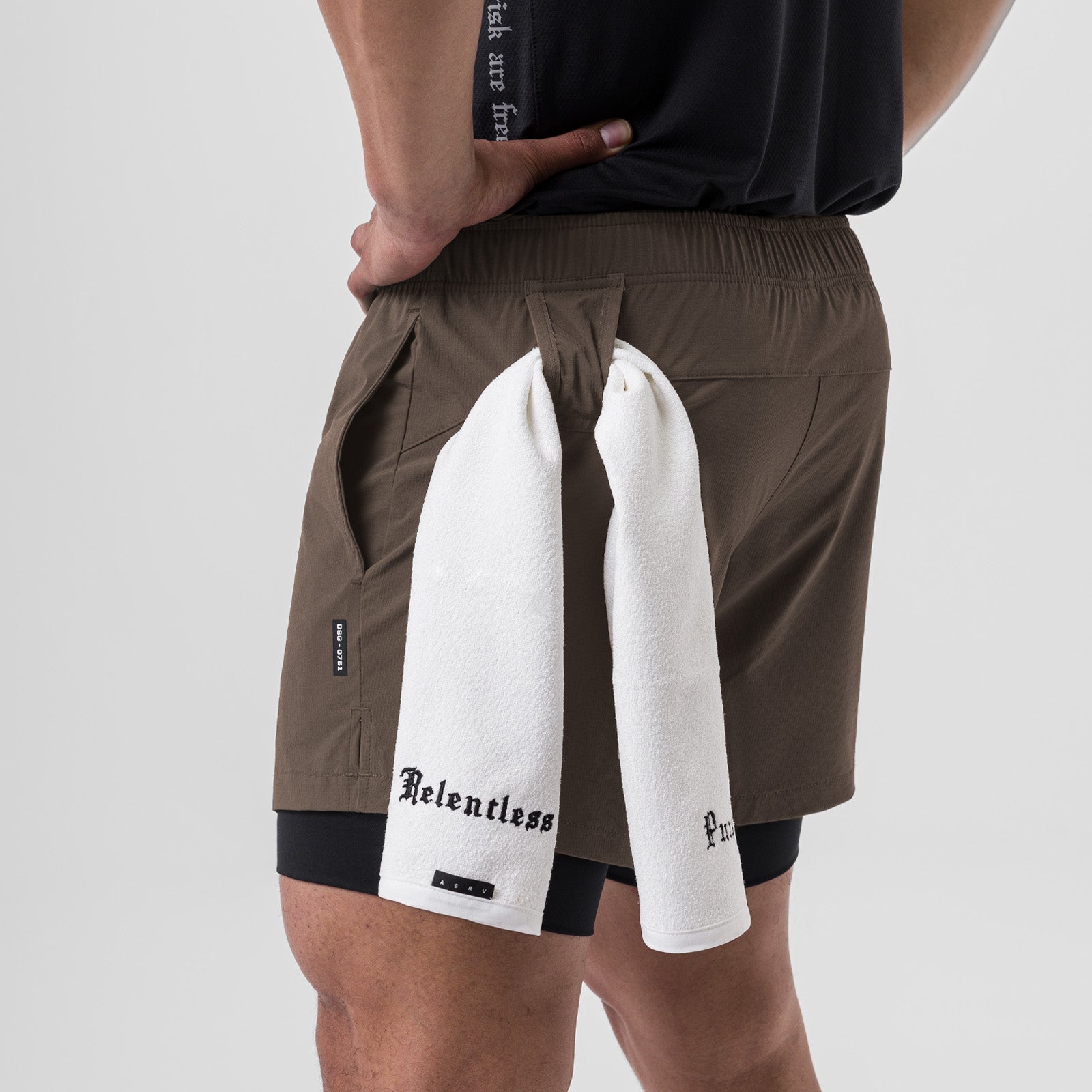 Ripstop 5" Liner Short in deep taupe worn by model, back view with towel