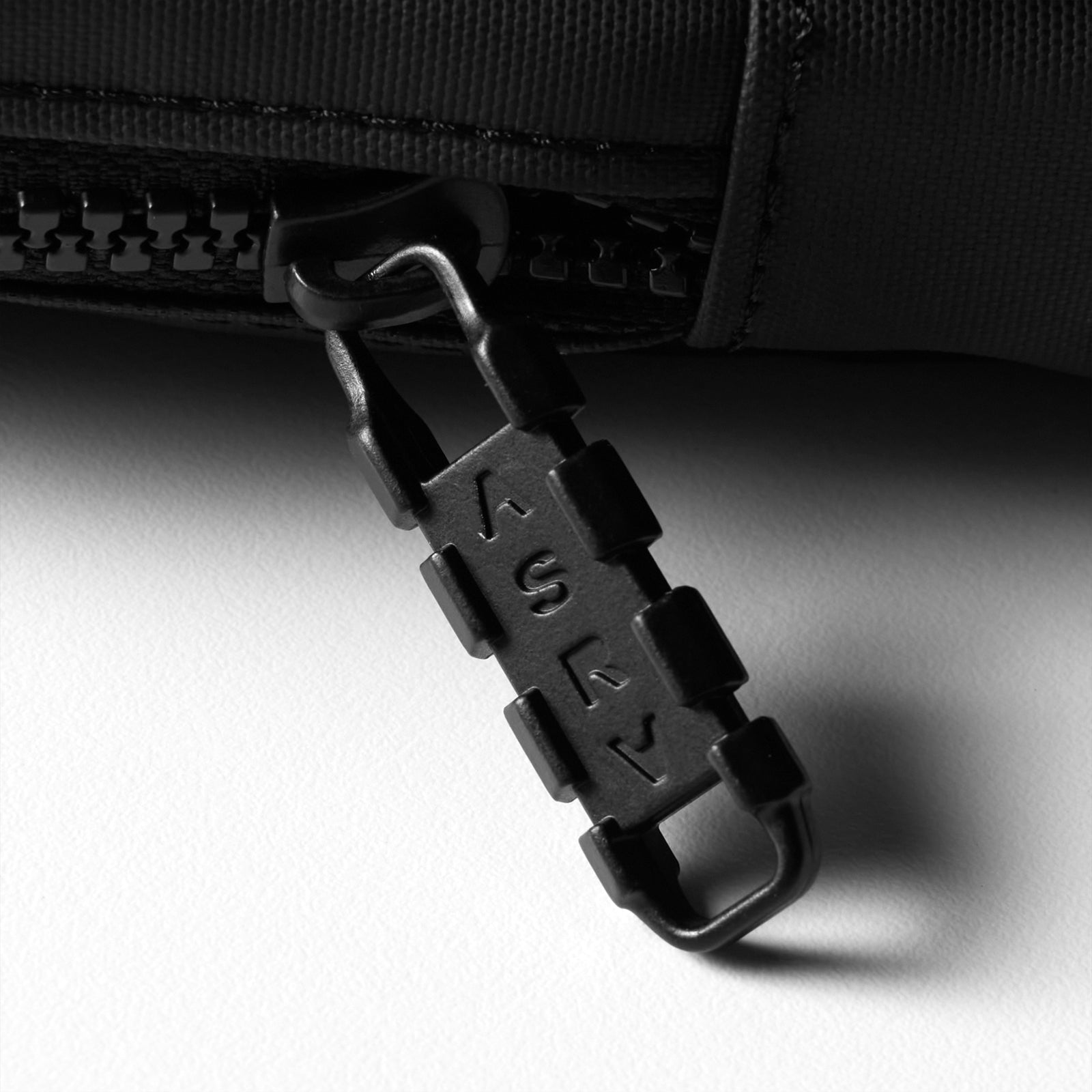 of black waterproof phone holster bag with carabiner attachment, angled view