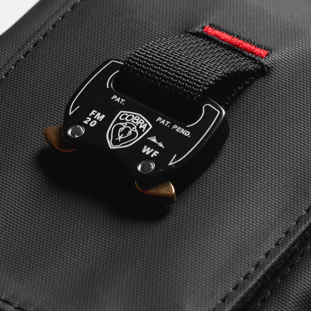 Waterproof Phone Holster Bag in black with red accent strap, overhead view