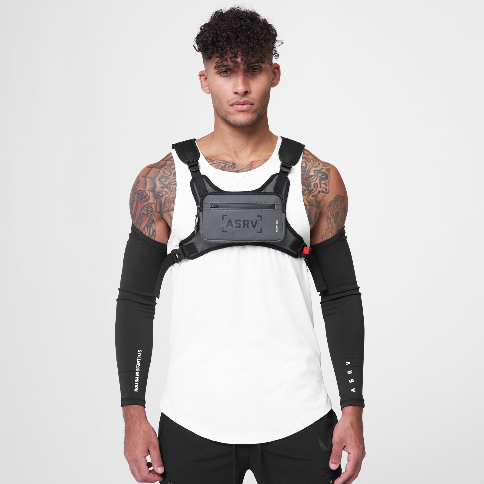 0634 Conditioning Chest Pack in grey, worn on model with black arm sleeves