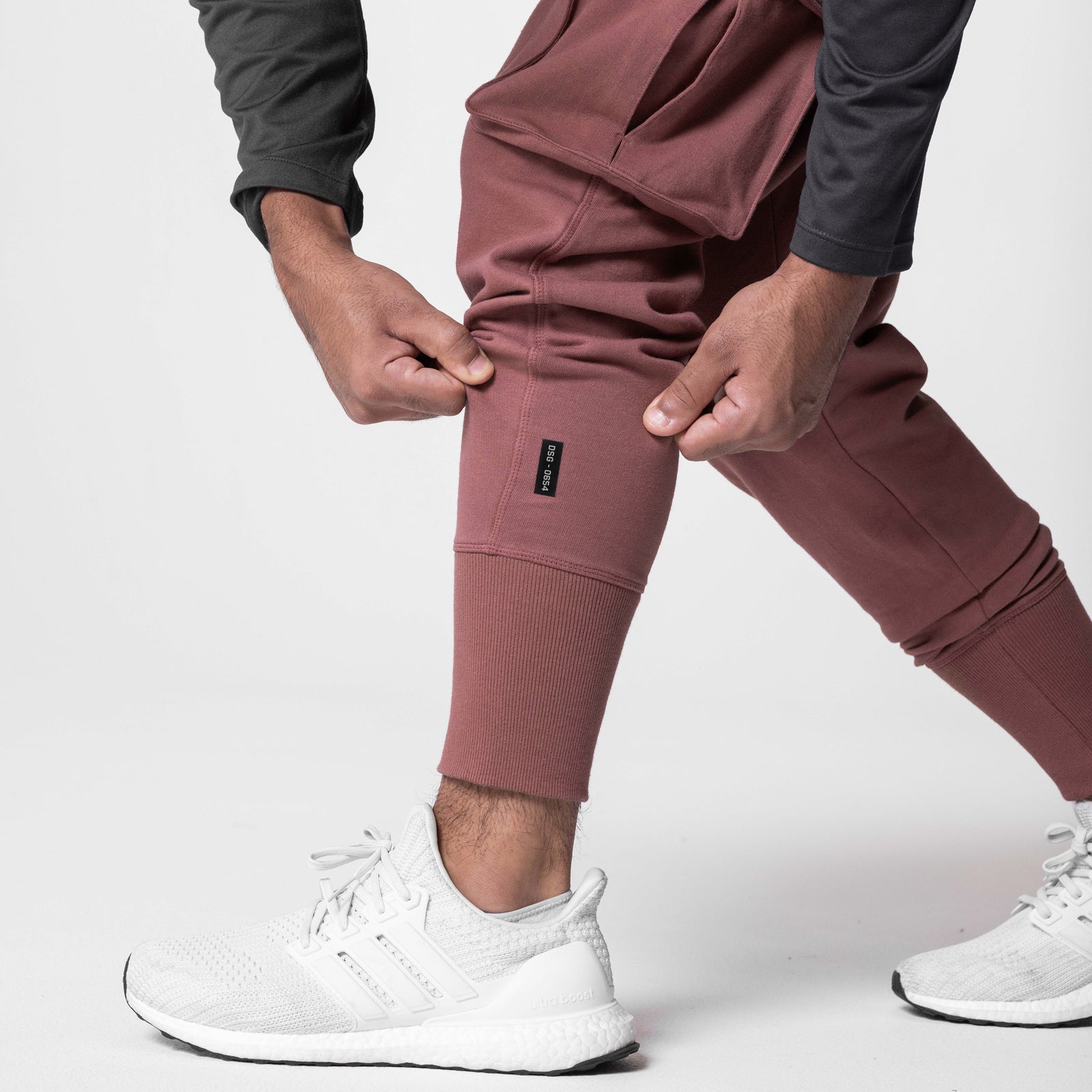 Tech-Terry Cargo High Rib Jogger in red earth worn by model with white sneakers