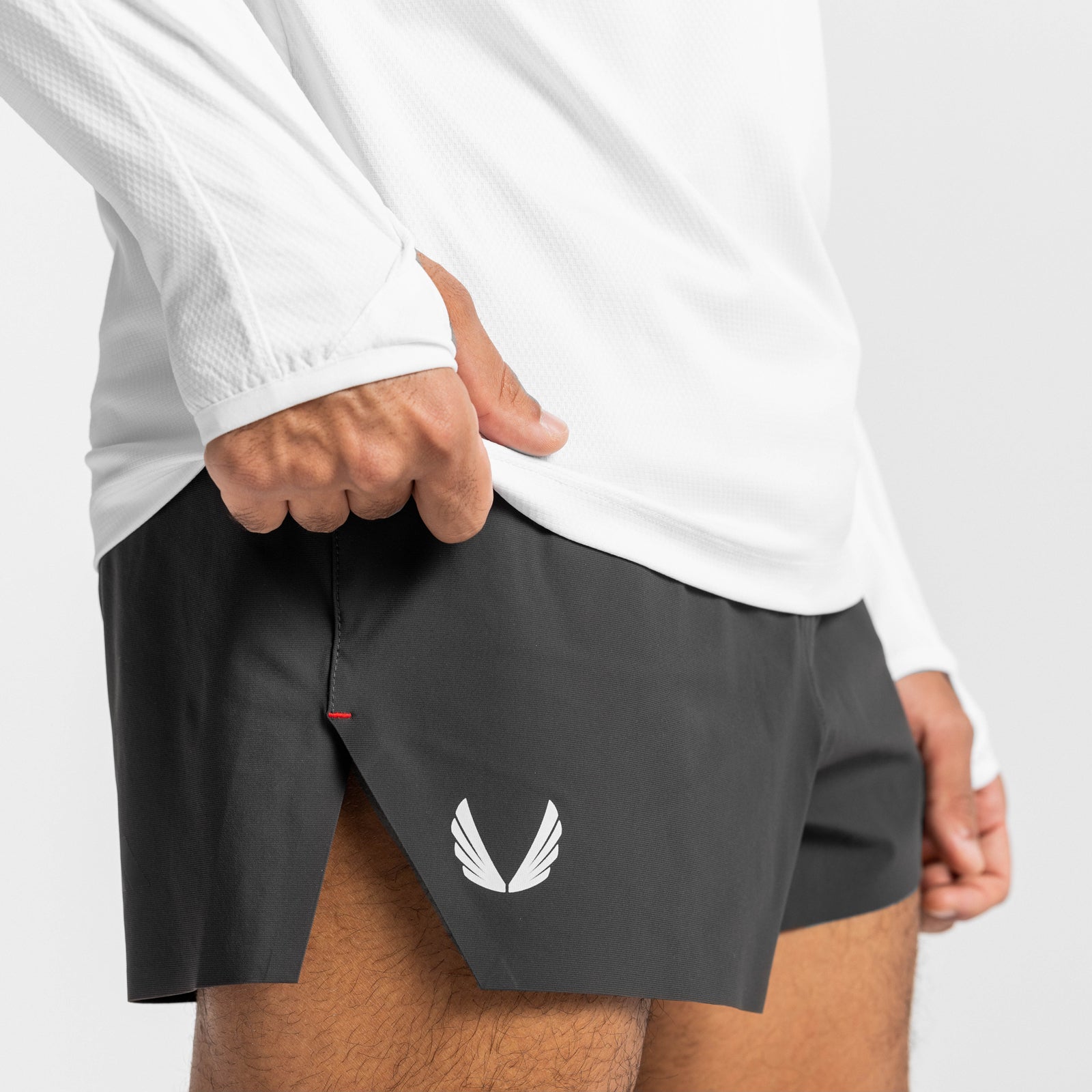 Tetra-Lite Laser Cut 3" shorts in space grey, modeled on person wearing white long-sleeve shirt