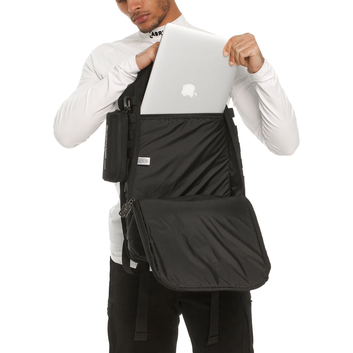 0275 Modular Everyday Pack in black, worn by model demonstrating laptop compartment