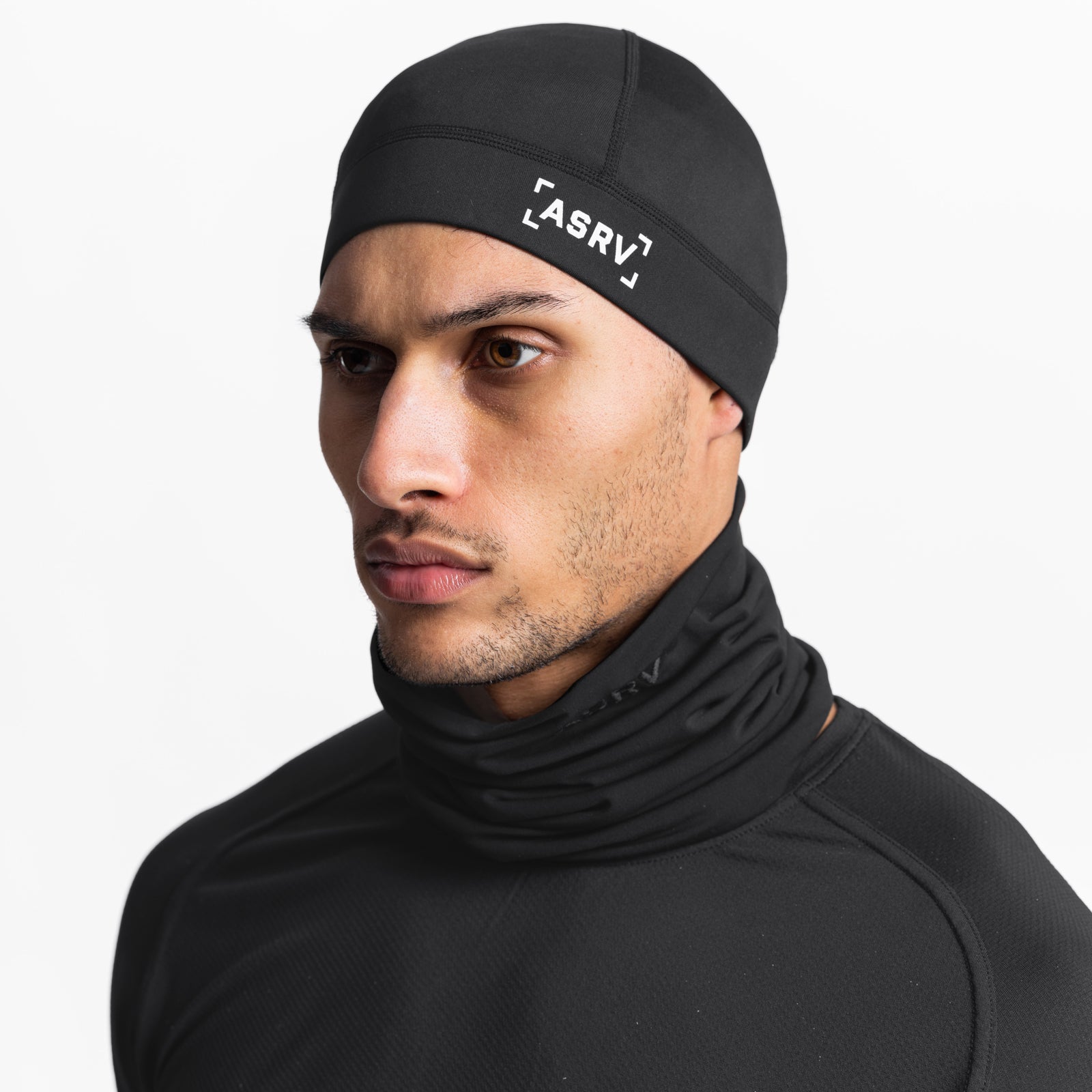Black Performance Bracket Logo Skull Cap worn by male model, side profile view