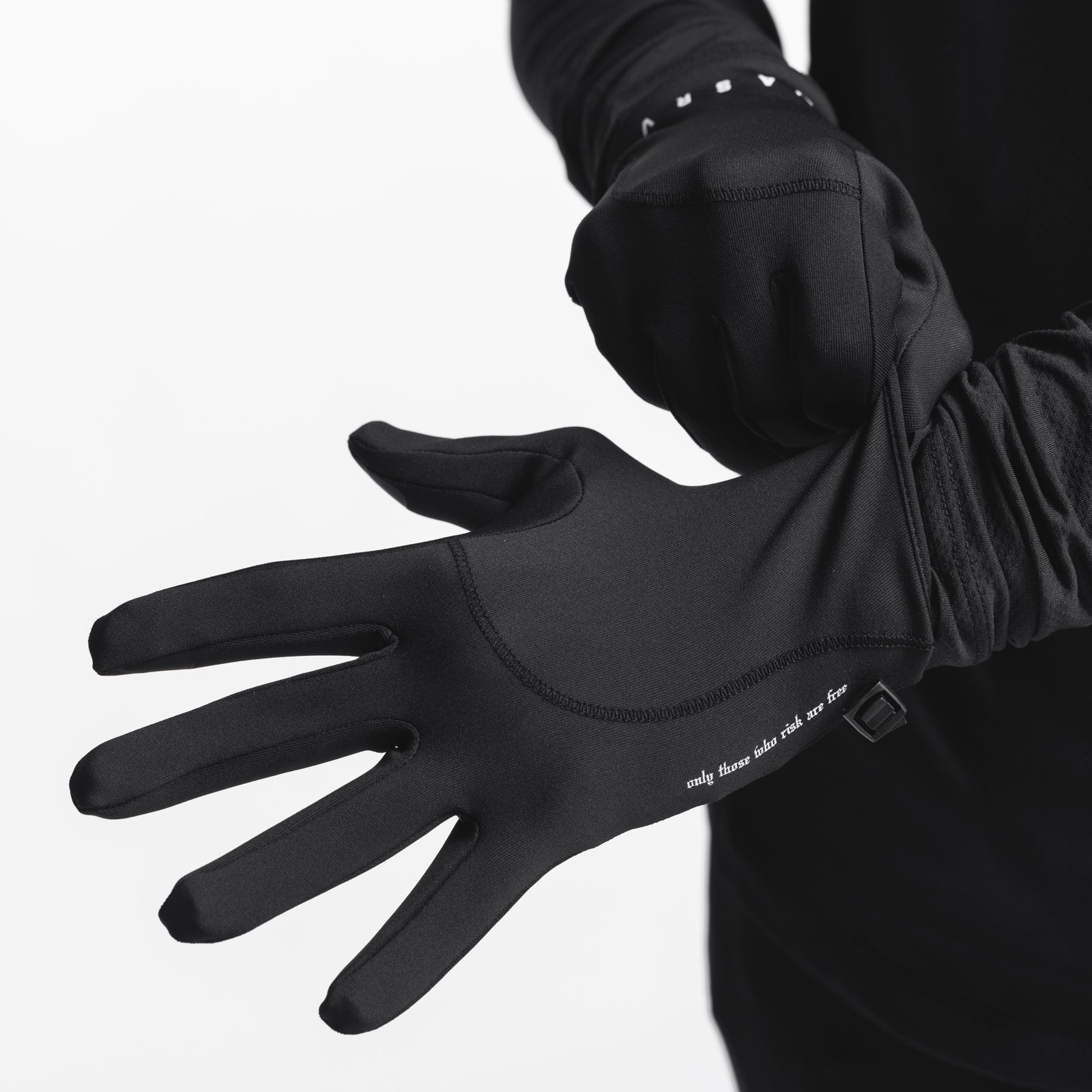 Aeroheat® Lightweight Gloves in black, worn on hands with arms extended, studded wrist detail visible