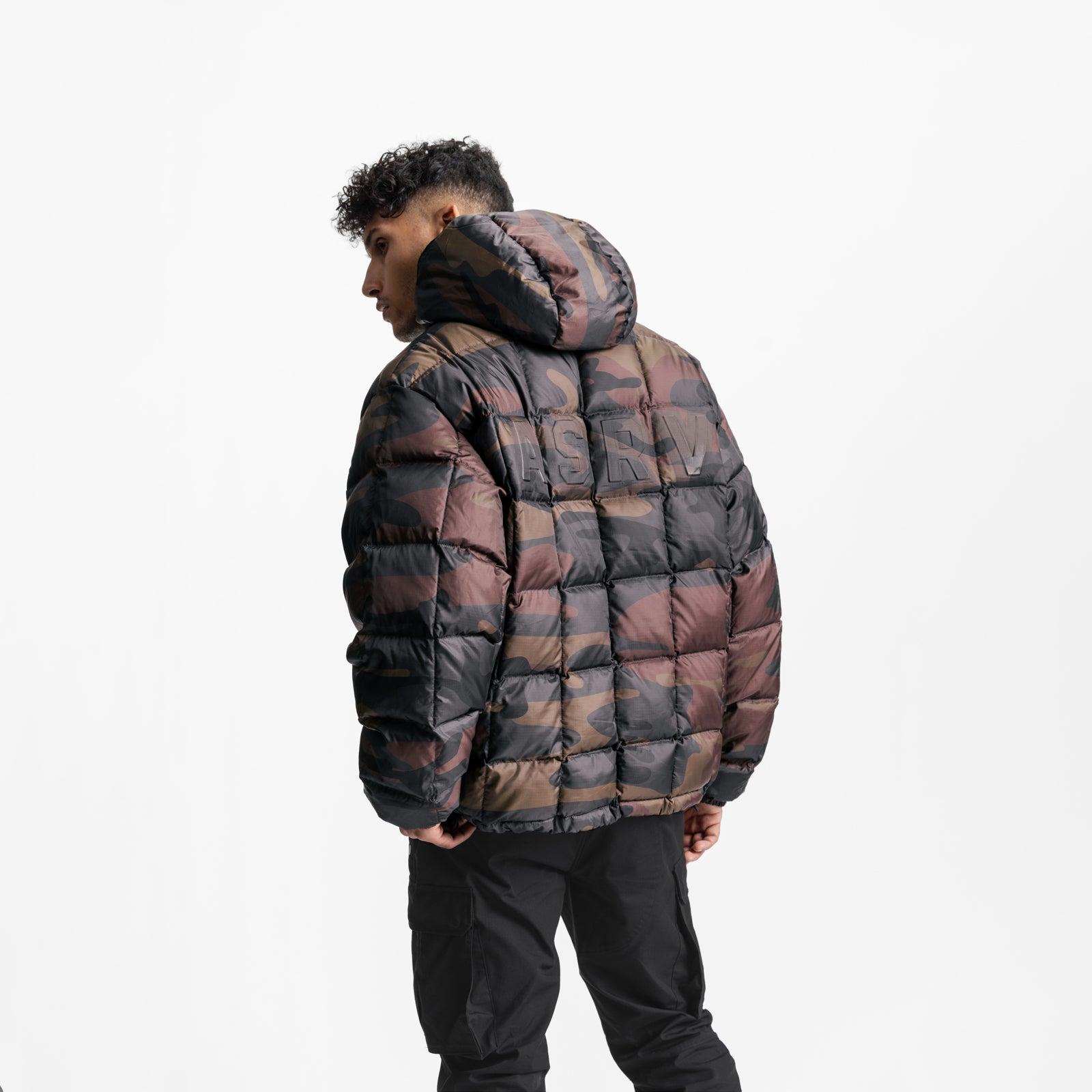 Weather-Ready Down Puffer Jacket in rust camo plaid, worn by model from back angle