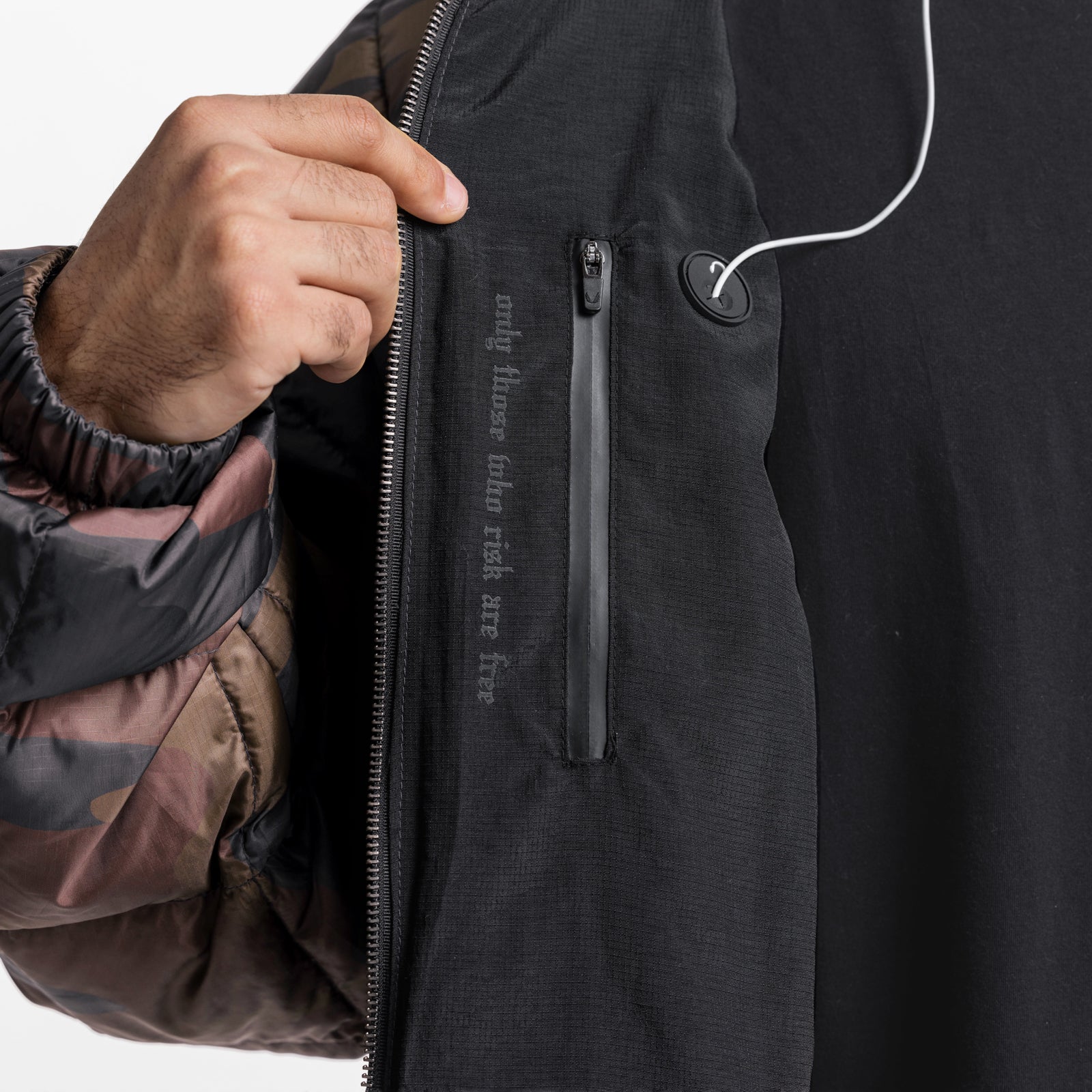 Weather-Ready Down Puffer Jacket in rust camo, worn and zipped by model with earbuds visible