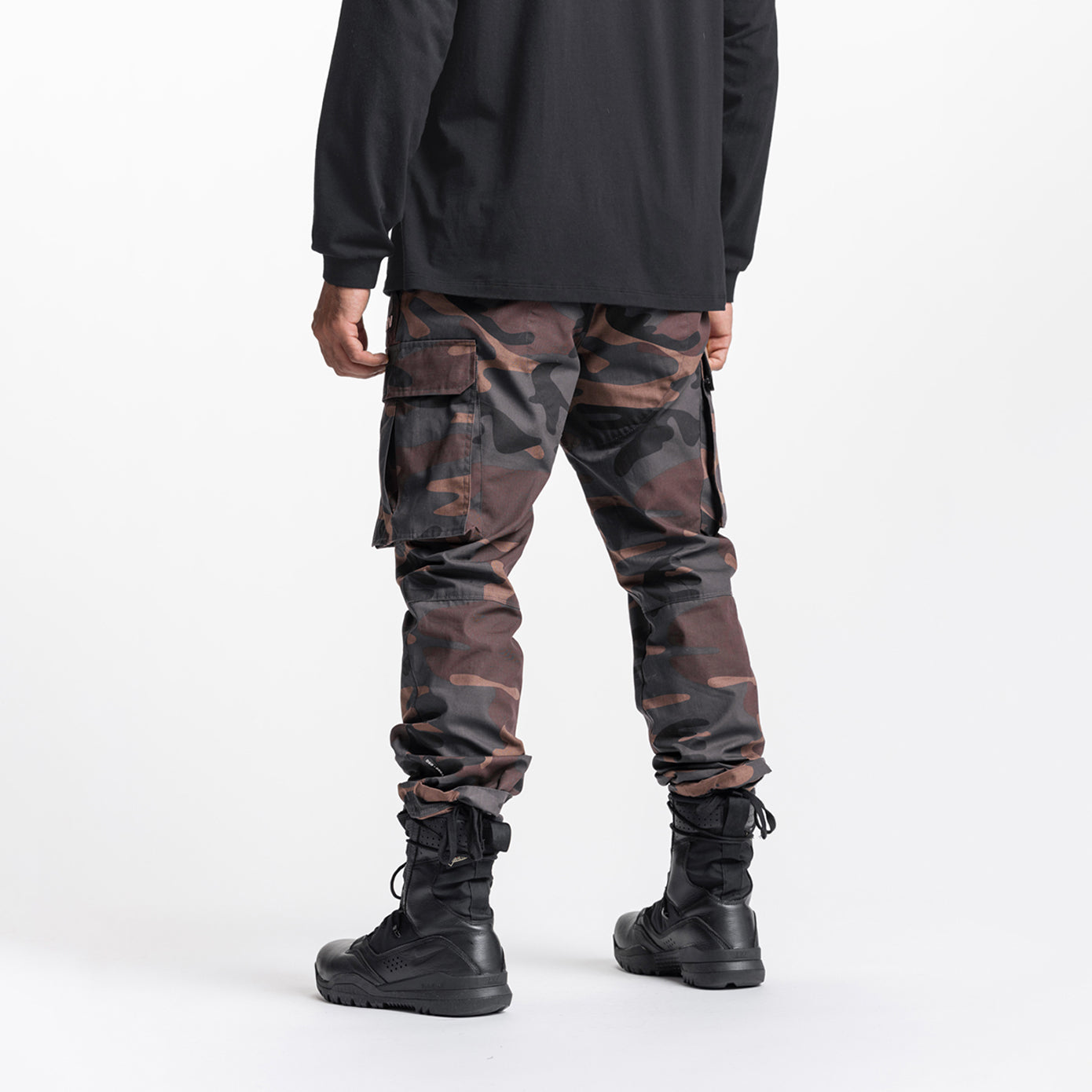 Weather-Ready Technical Cargo Pant in rust camo, worn with black boots, back view
