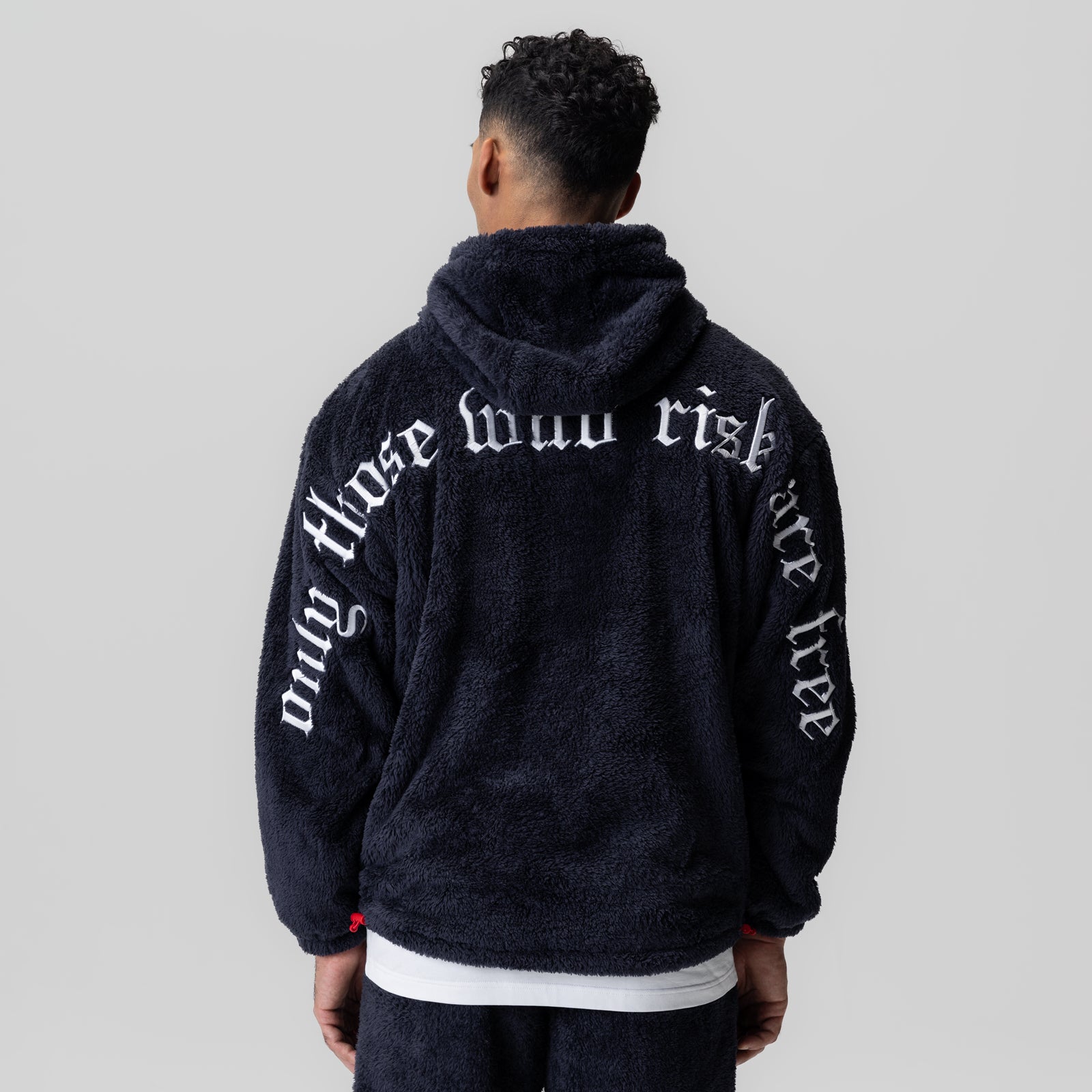 Sherpa Recovery Hoodie in navy with white text, back view on model